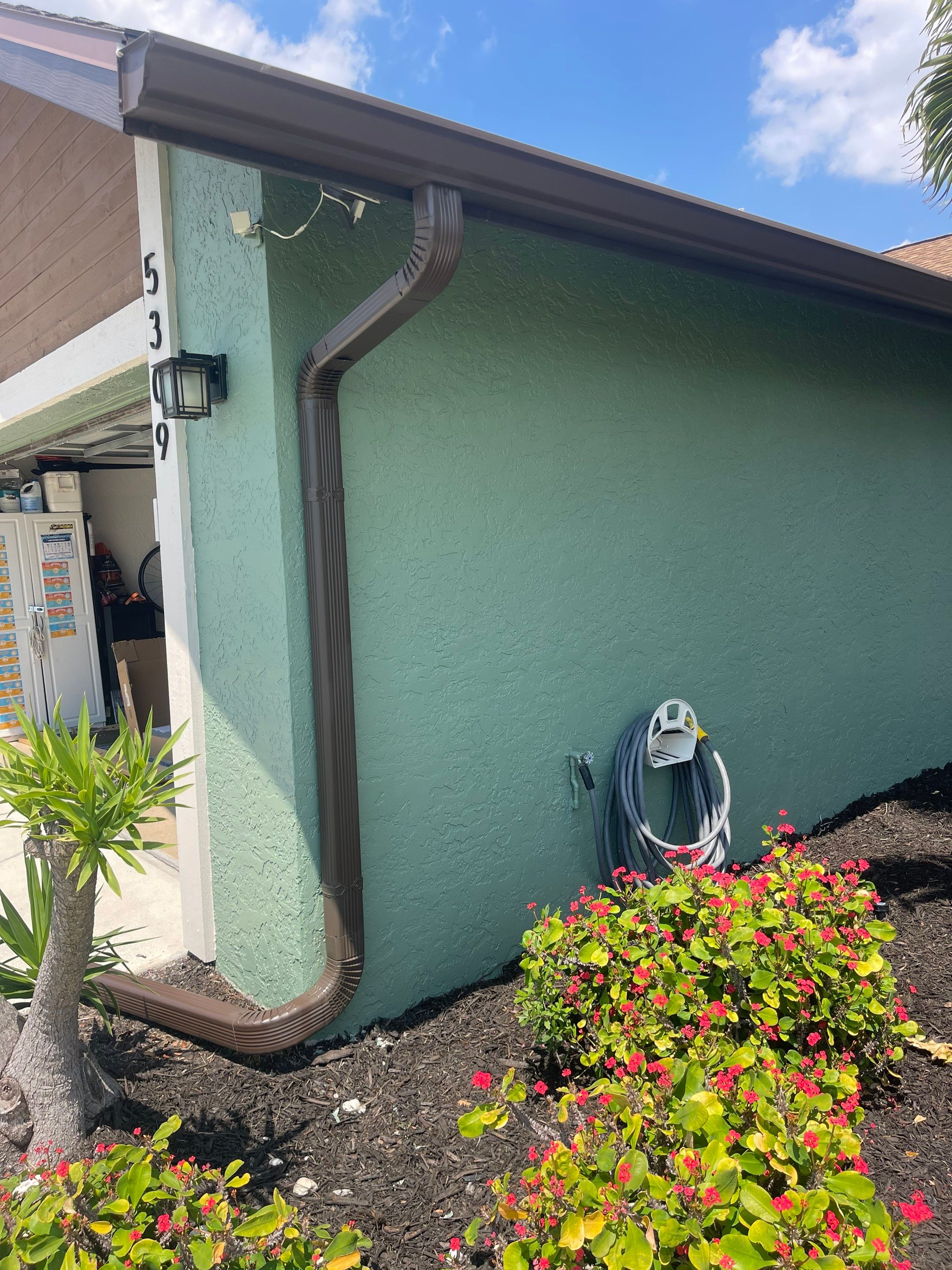 Musket Brown Seamless Gutter Installation Before Rainy Season in Cape Coral FL by Gutter Professors