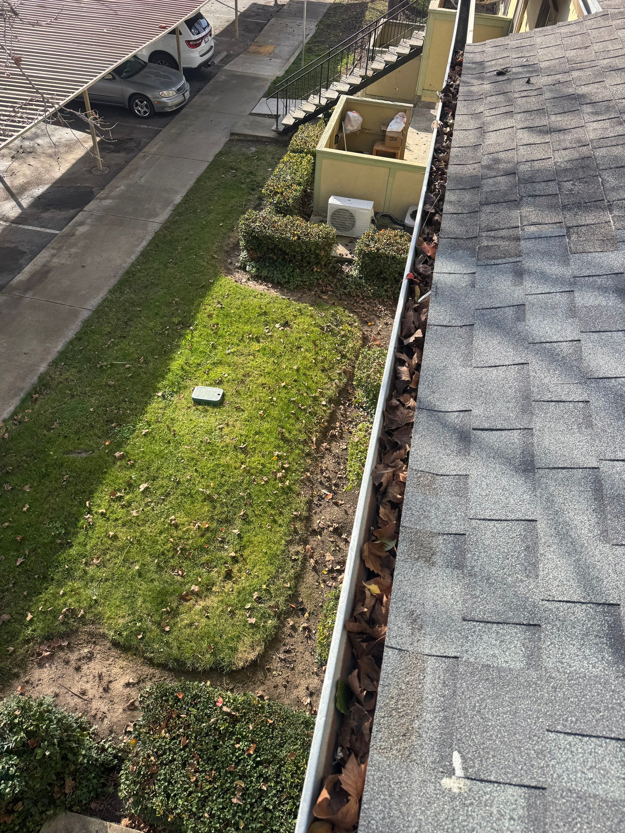 Commercial gutter cleaning Elk Grove, CA before photo with filled gutters