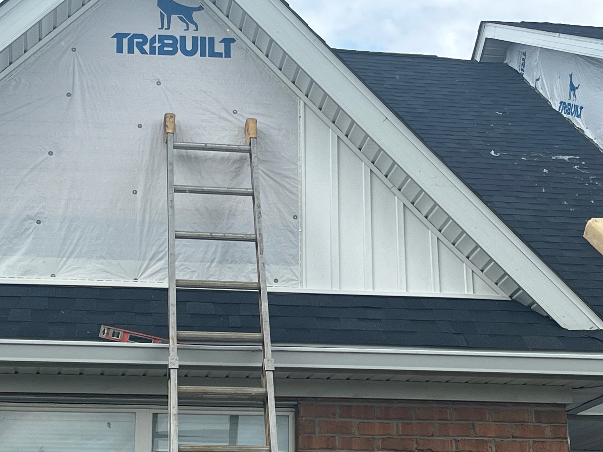 Exterior Installation using Onyx Black Durations and White Siding by WIW Enterprises Inc