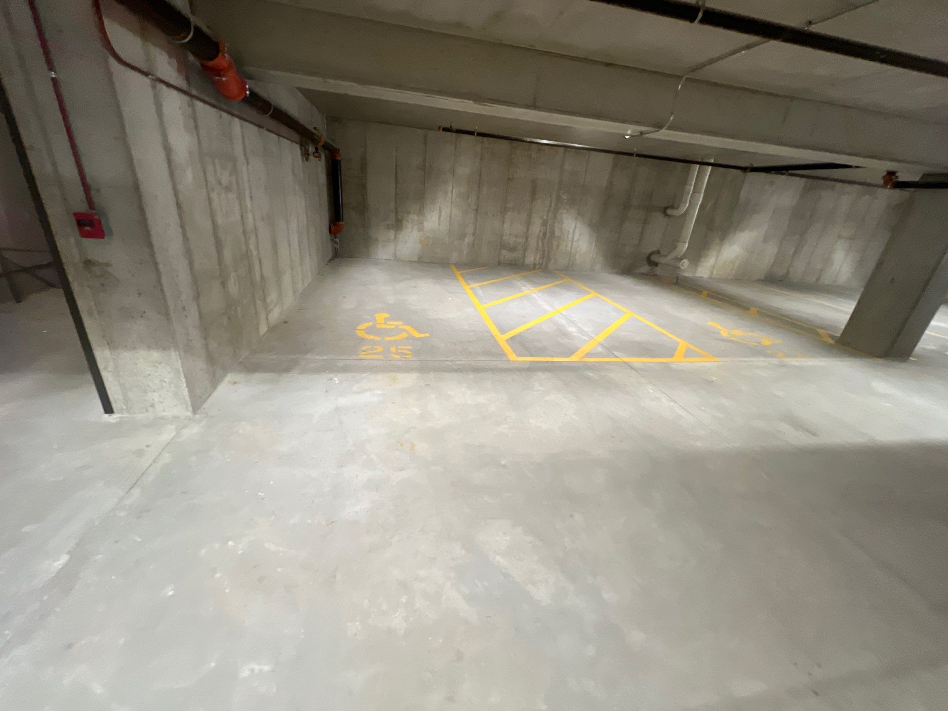 Parking garage using Hot water by Northern Power Washing LLC.