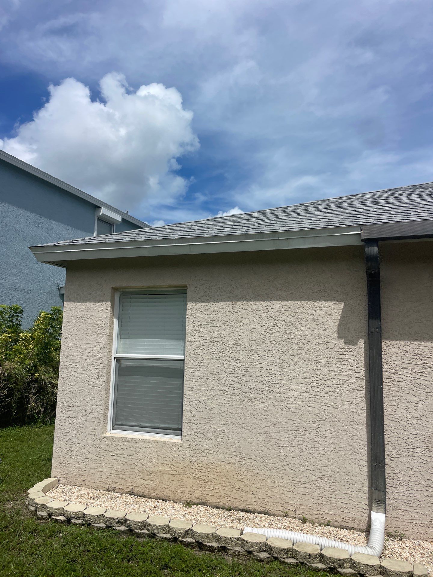 White Aluminum Seamless Gutters and Downspouts in Estero FL by Gutter Professors