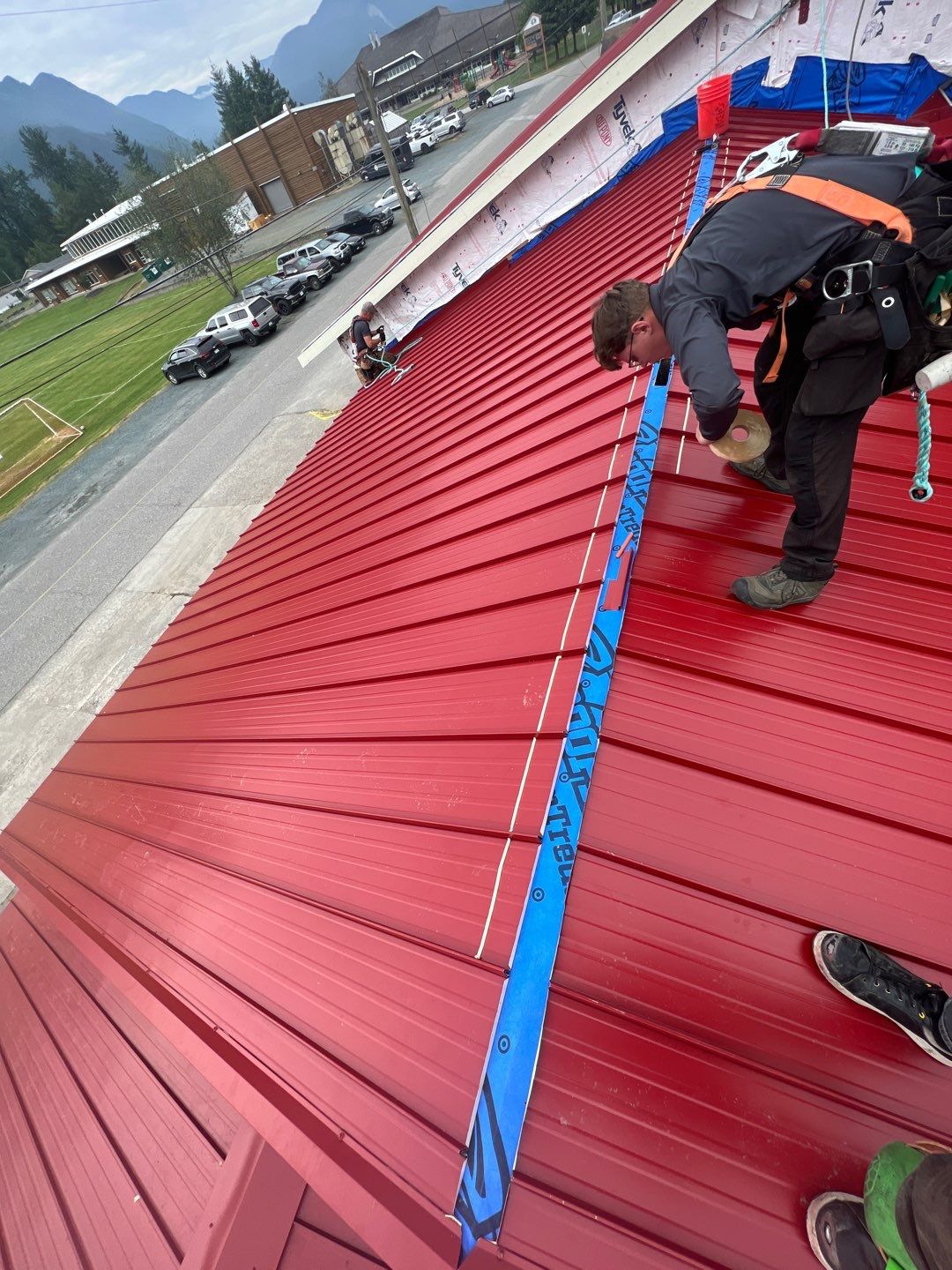 Commercial Roofing Installation using 12" Prolok metal  by Top Notch Roofing Inc