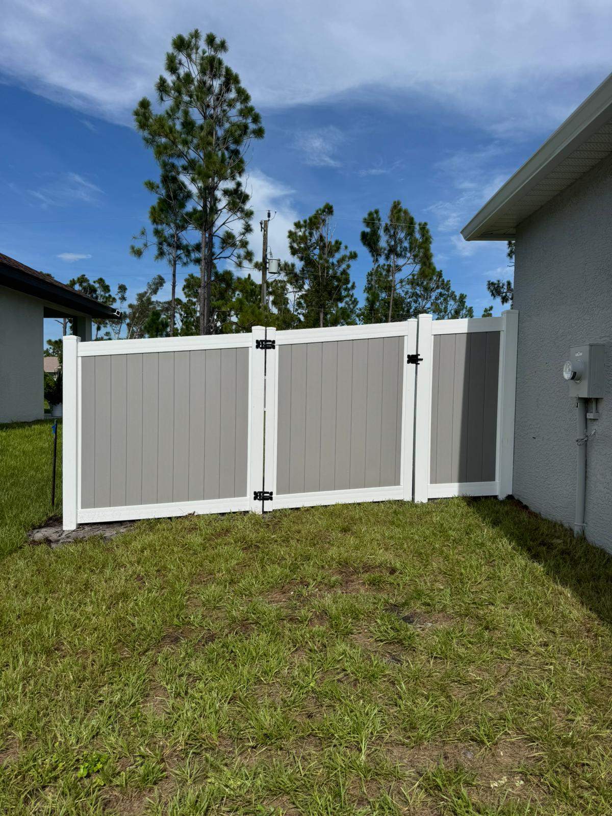 Two-Tone Vinyl Privacy Fence Installation in Port Charlotte by True Fence LLC