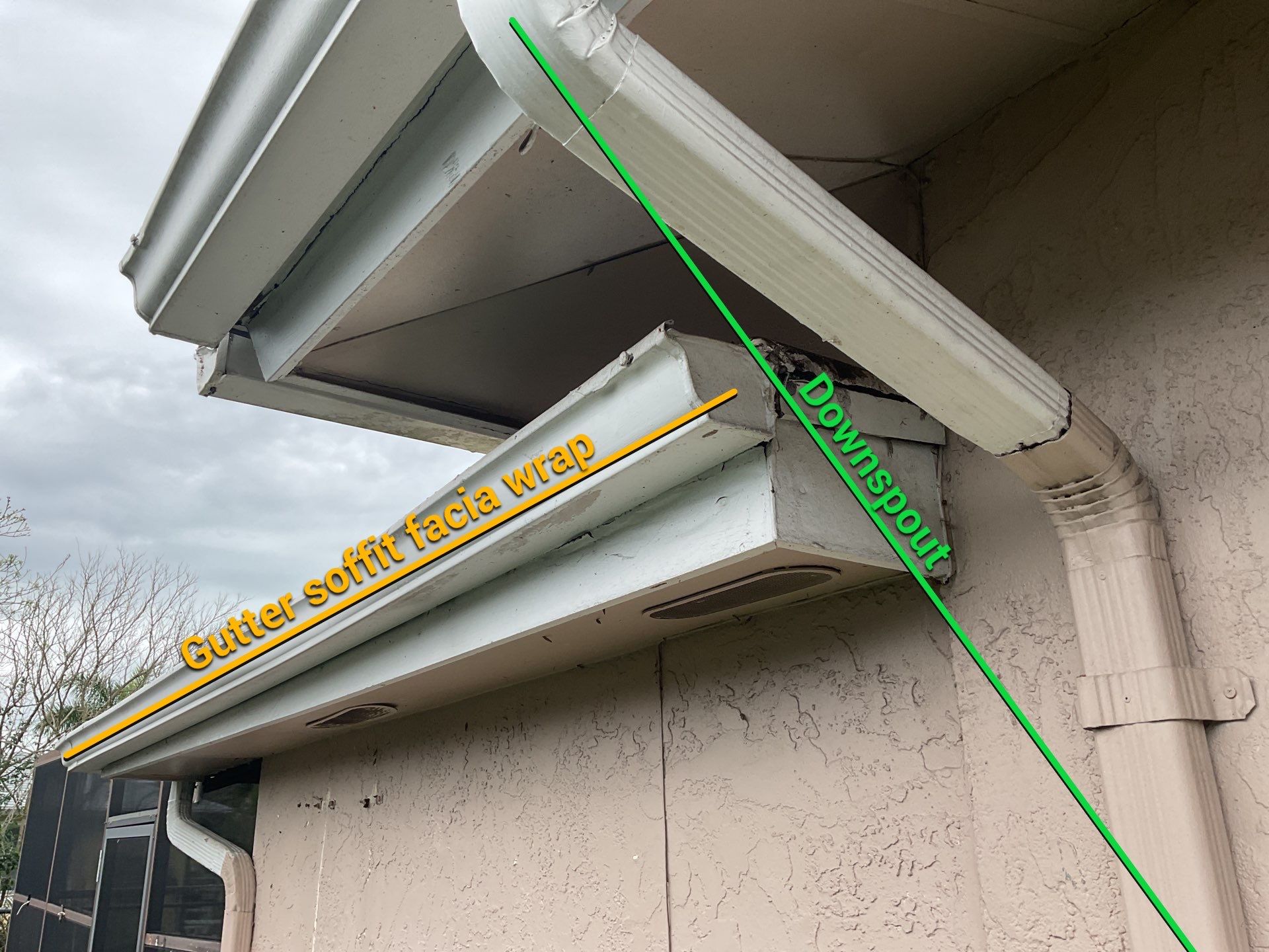White Seamless Gutters and Splash Guards in Fort Myers FL by Gutter Professor by Gutter Professors