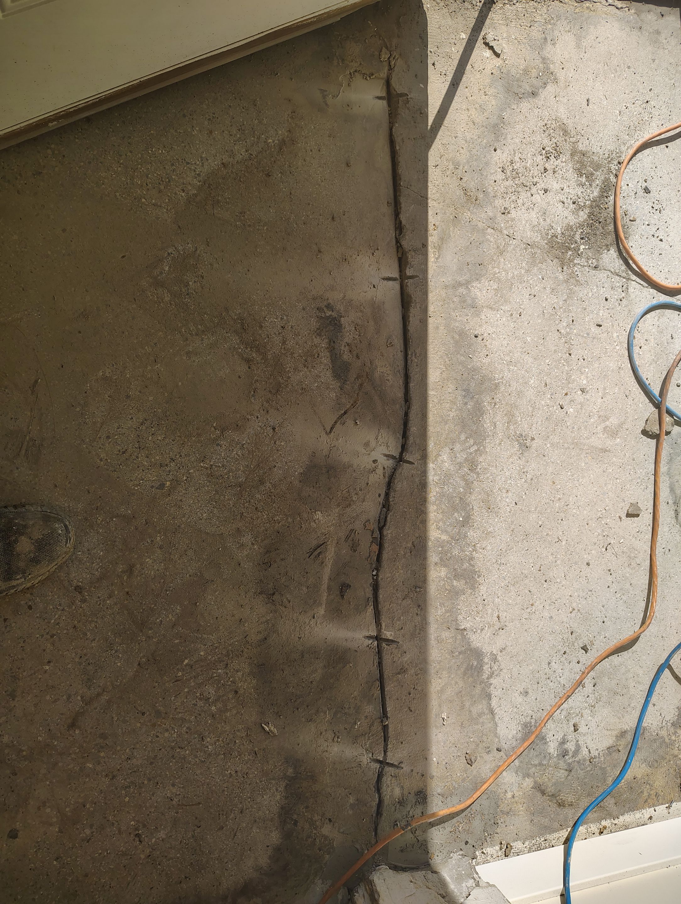 Comprehensive Basement Concrete Floor Coating and Crack Repair in Sioux Falls by Select Painting, Coatings & Garage Cabinets