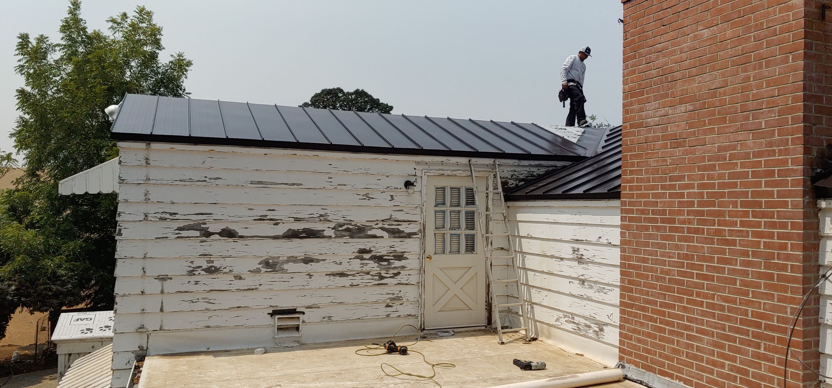 Residential Roofing Installation using Standing seam metal roofing system by Straight Edge Roofing Inc