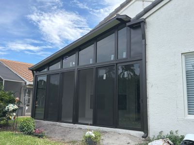 Custom Impact Sunroom with Bronze Aluminum Framing and Windows in Boynton Beach