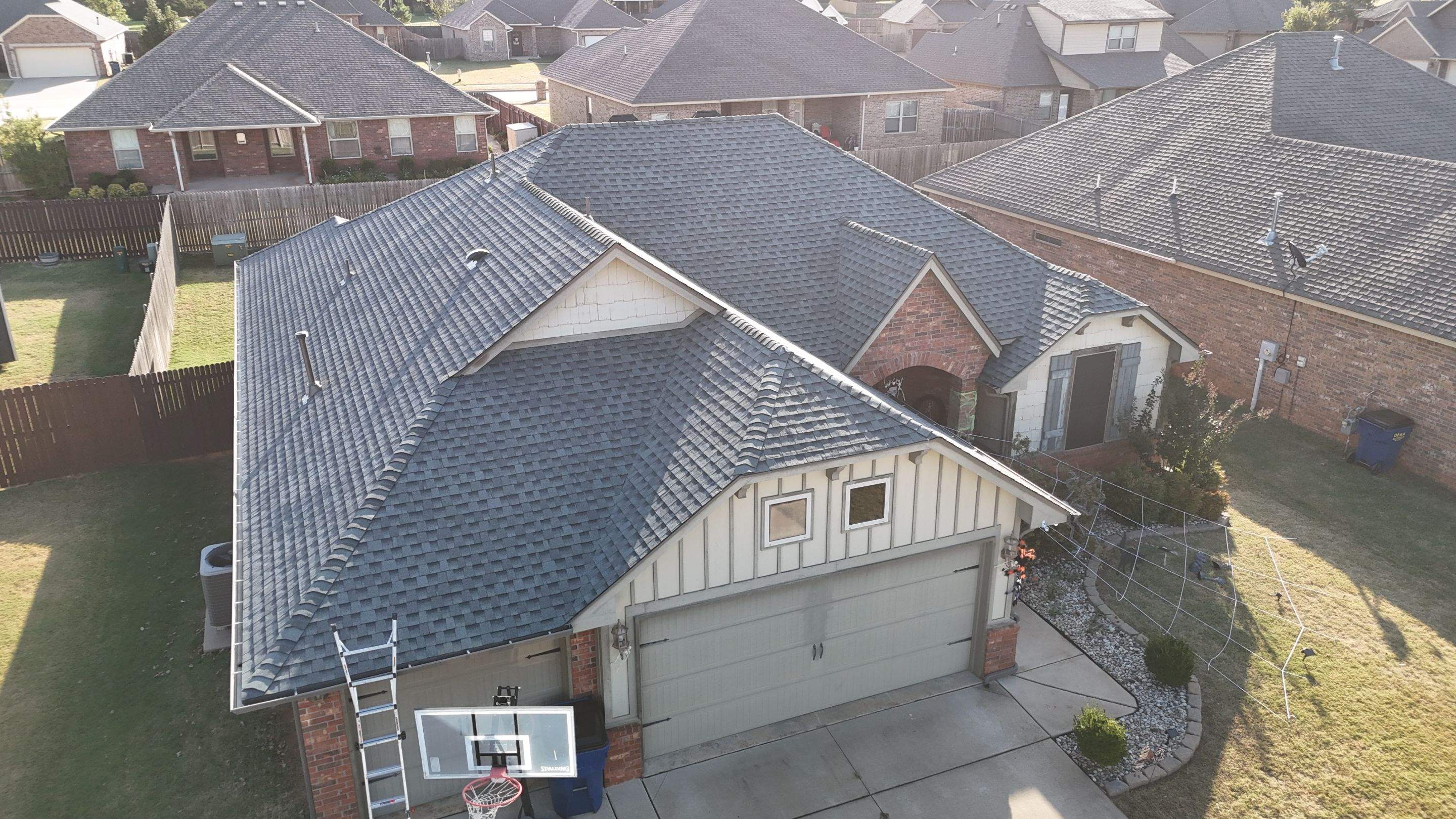Roof Replacement in Mustang, OK by 5Coat Roofing & Construction