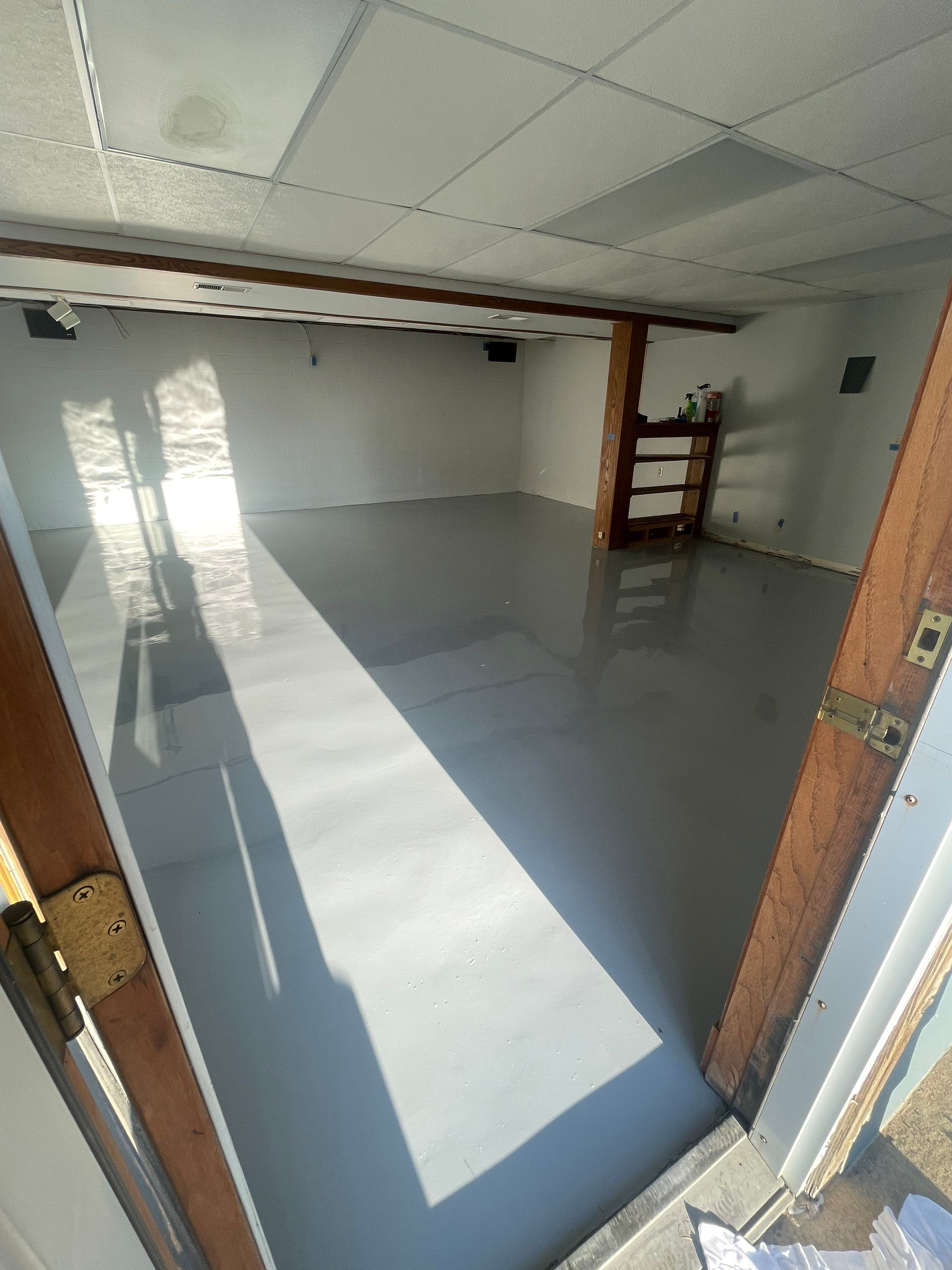 Solid Color Concrete Floor Coating for Renner Basement by Select Painting, Coatings & Garage Cabinets