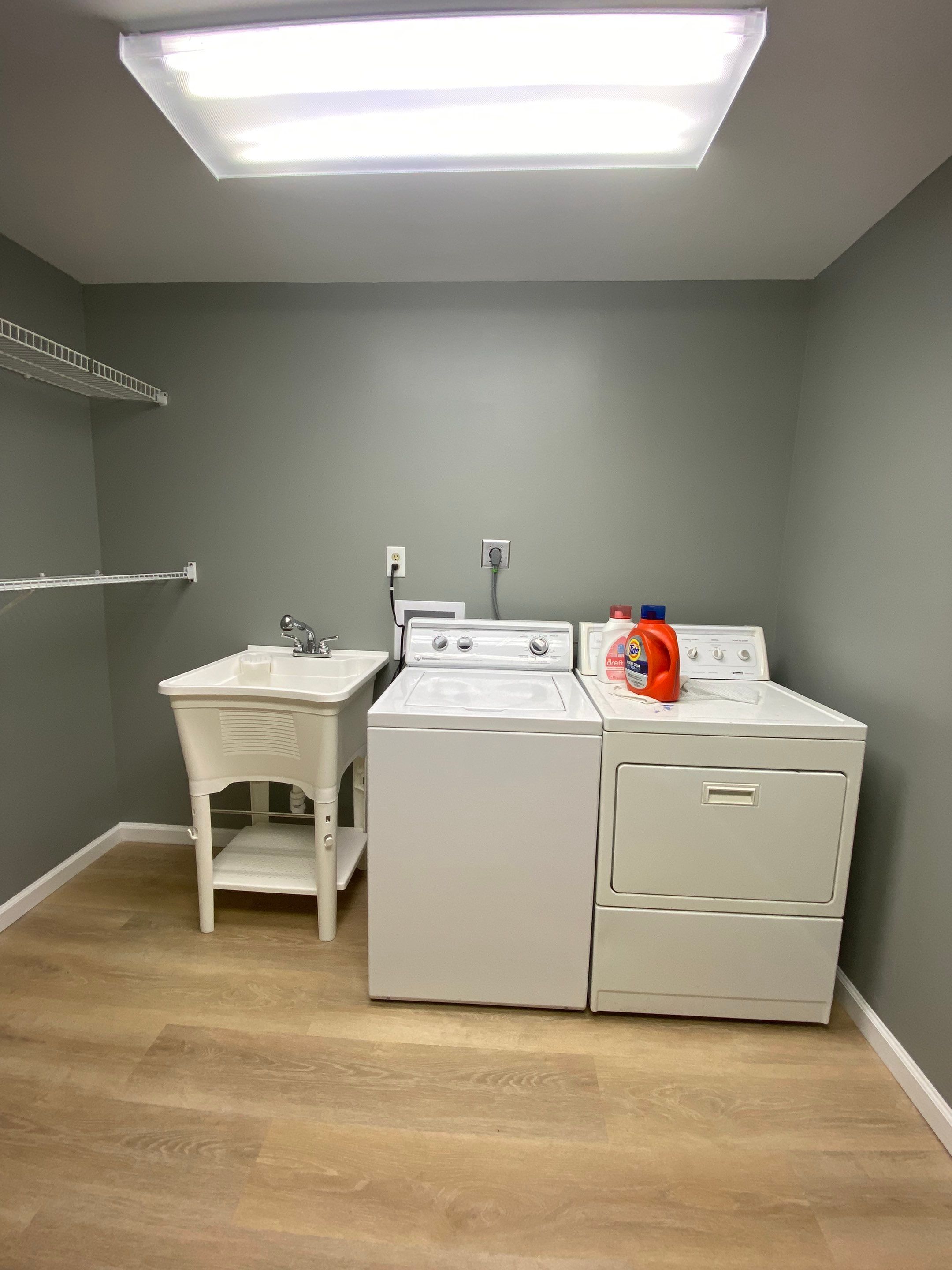 Laundry Room Redmodel using Lifeproof Luxury Vinyl Plank Flooring by The Smet Companies, LLC