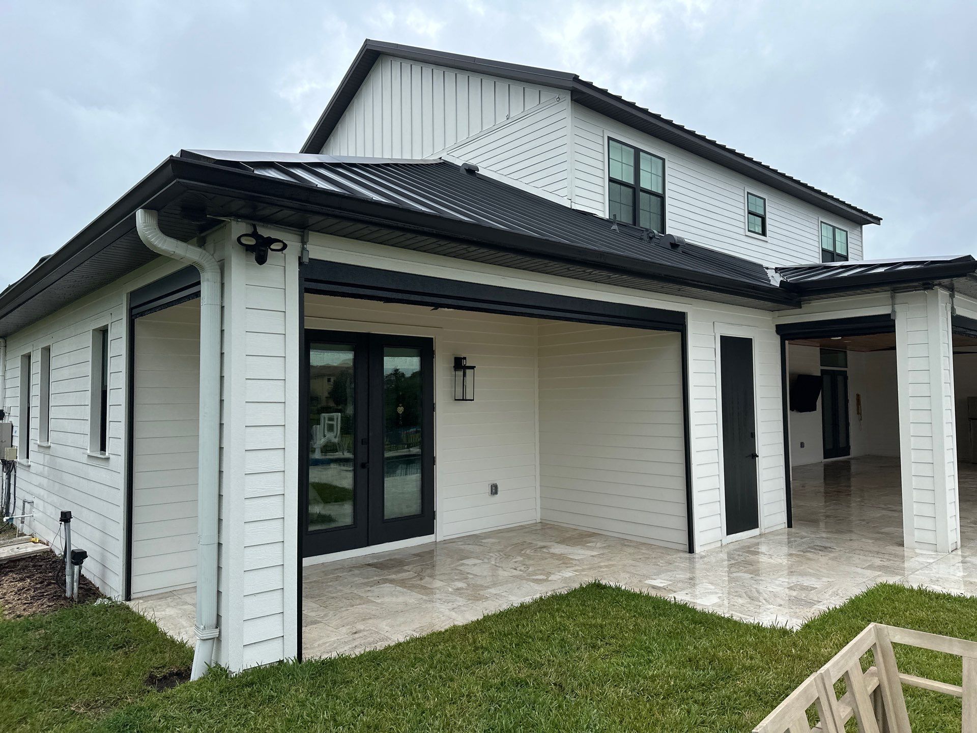 Complete Two-Story House Wash and Driveway Cleaning in Winding River Community, Bradenton, FL by Sunshine AquaWash