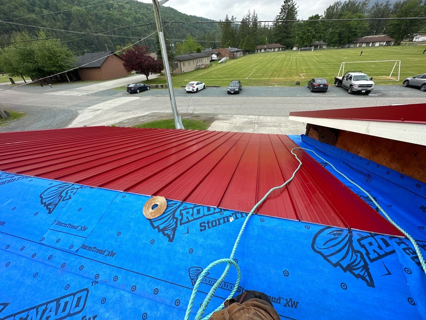 Commercial Roofing Installation using 12" Prolok metal by Top Notch Roofing Inc