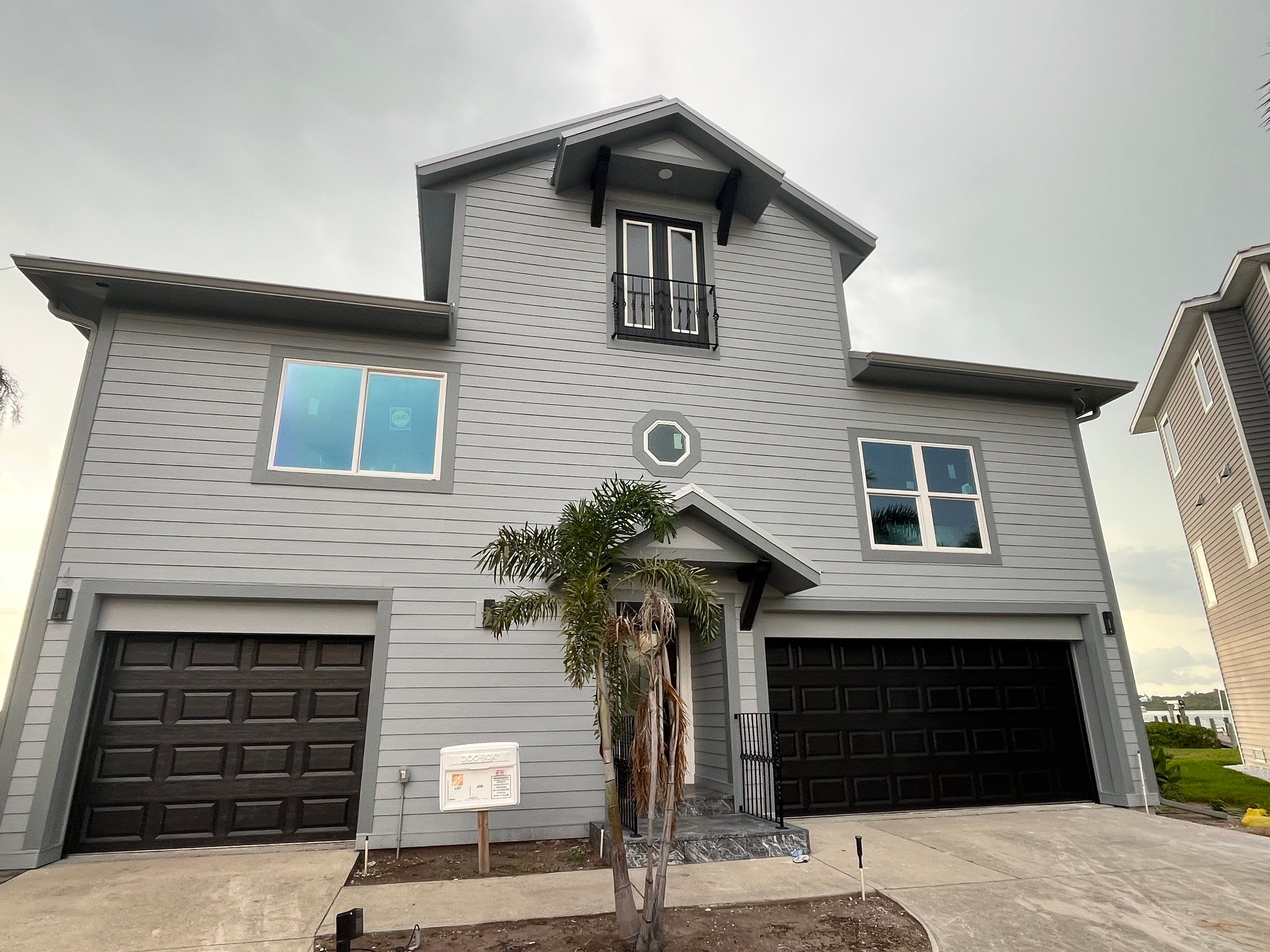 Downspout Installation Dove Grey Palmetto FL by Gutter Professors