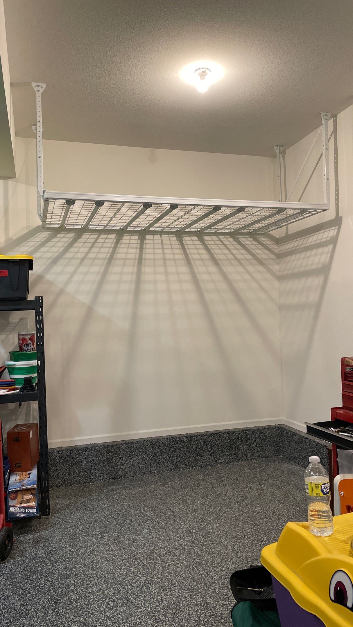 Stacy T. adds ceiling racks to garage for extra storage!  by Banner Garage