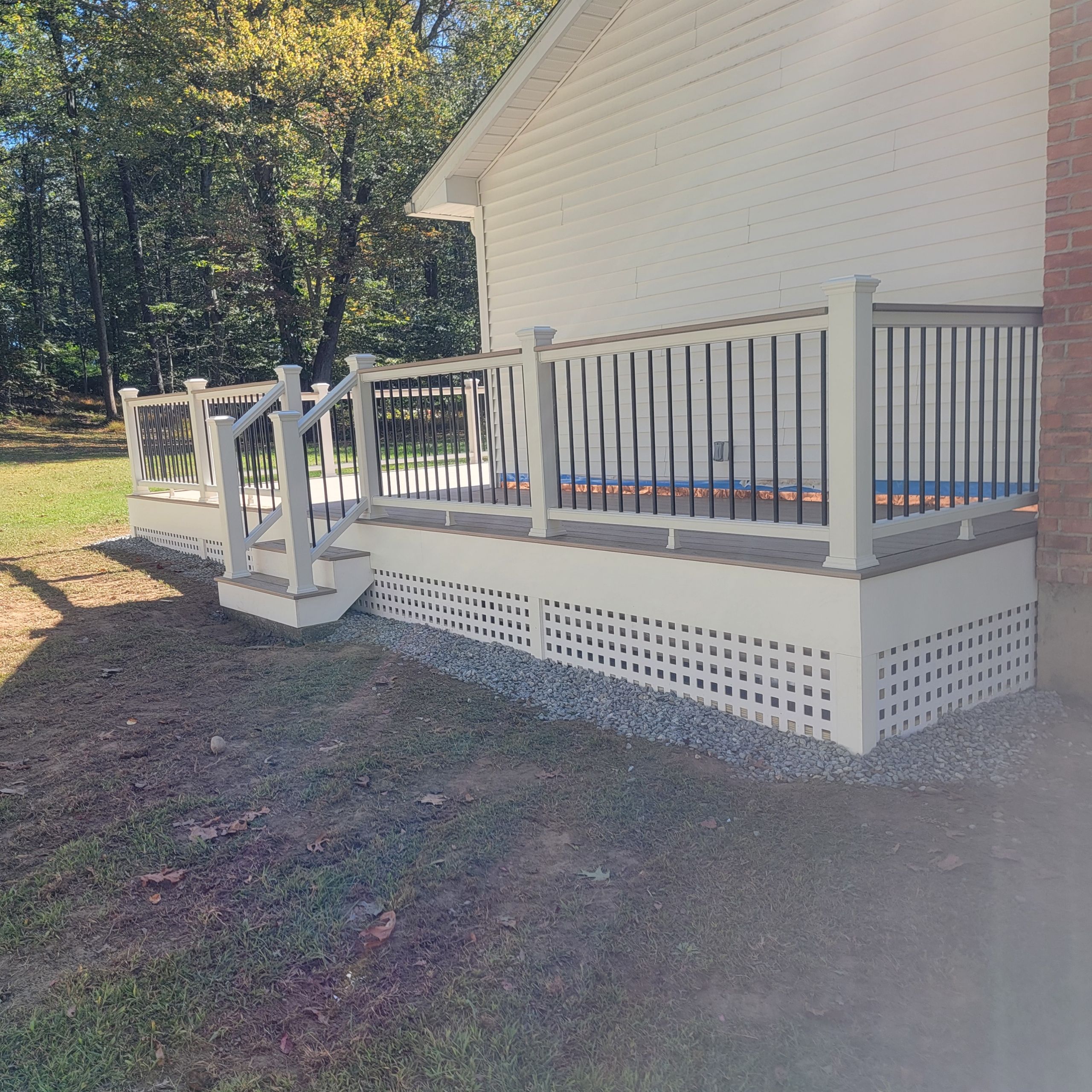 Deck replacement using Trex Transcend Rope swing and Transcend cocktail rail and trex lattice  by DiGiorgi Roofing and Siding Inc