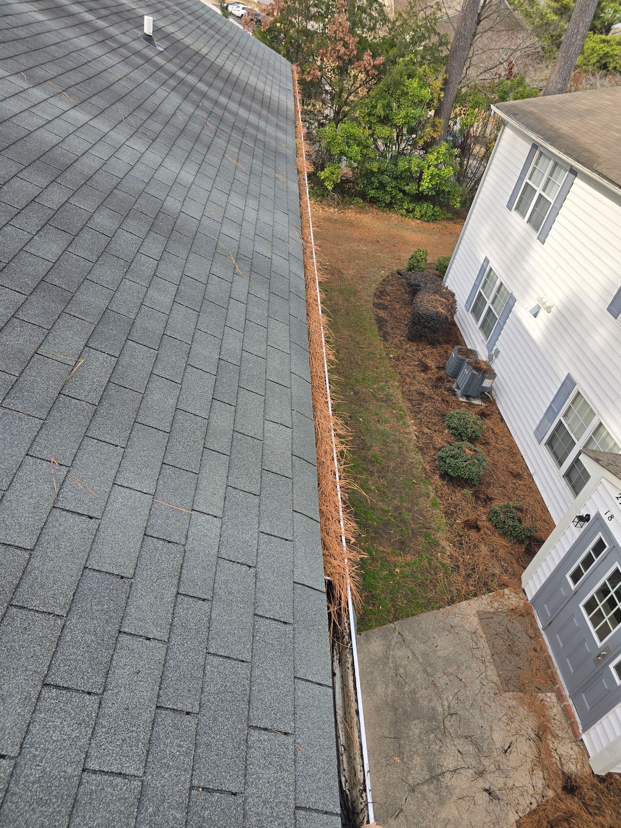 Commercial gutter cleaning Chesapeake, VA before photo with filled gutters
