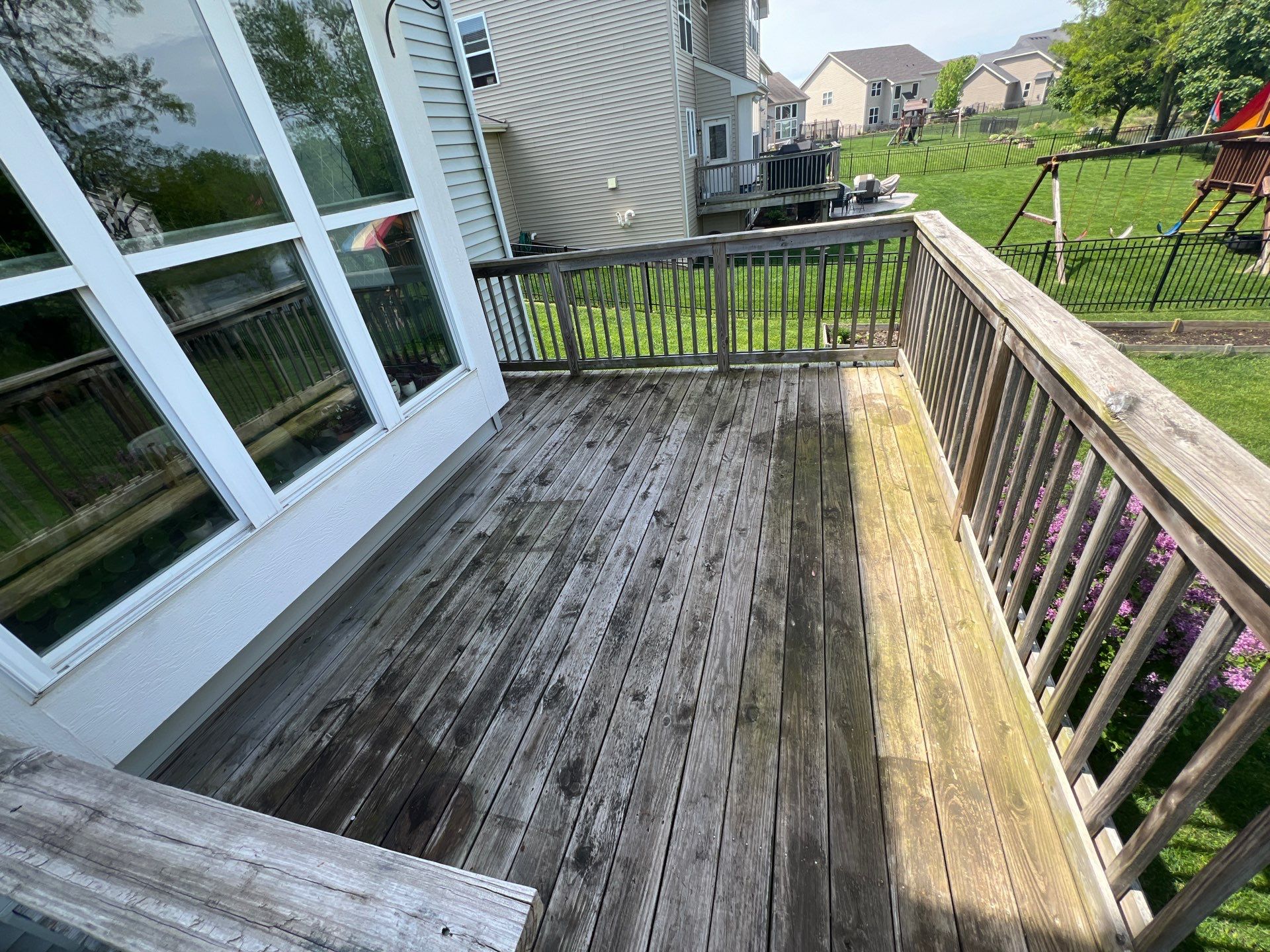 wood deck cleaning and staining by Northern Power Washing LLC.