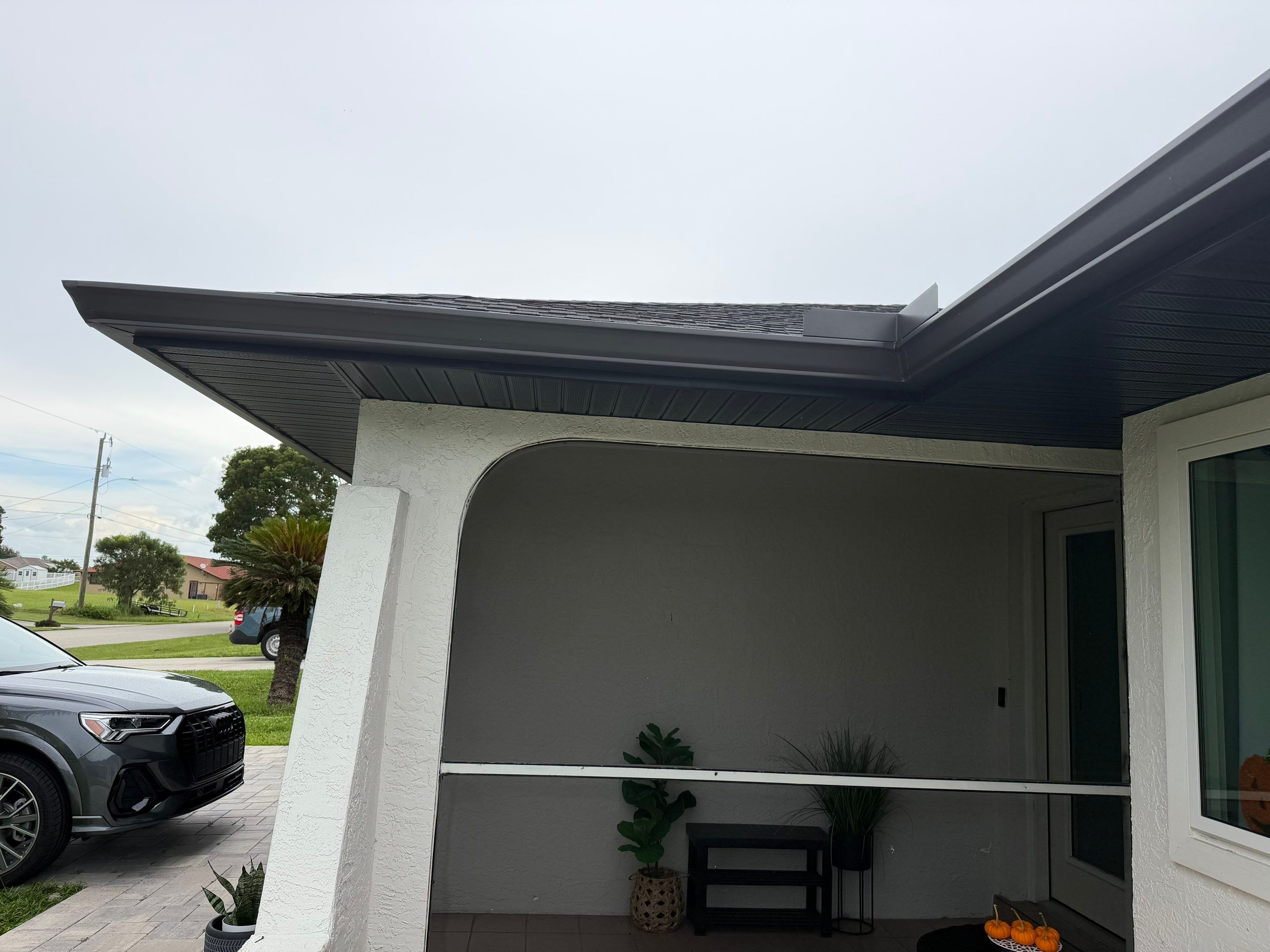 Black Seamless Gutters for a Modern Look in Cape Coral FL by Gutter Professors