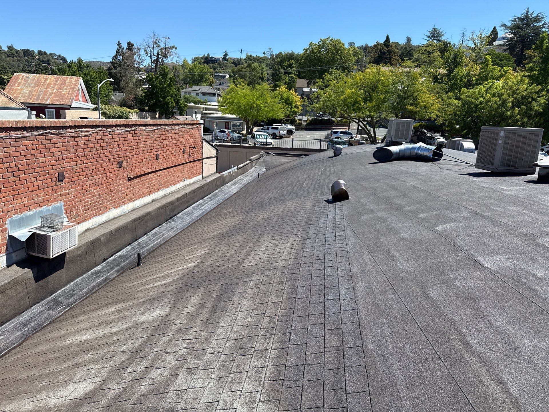 Foam and coatings on commercial roof by Straight Edge Roofing Inc