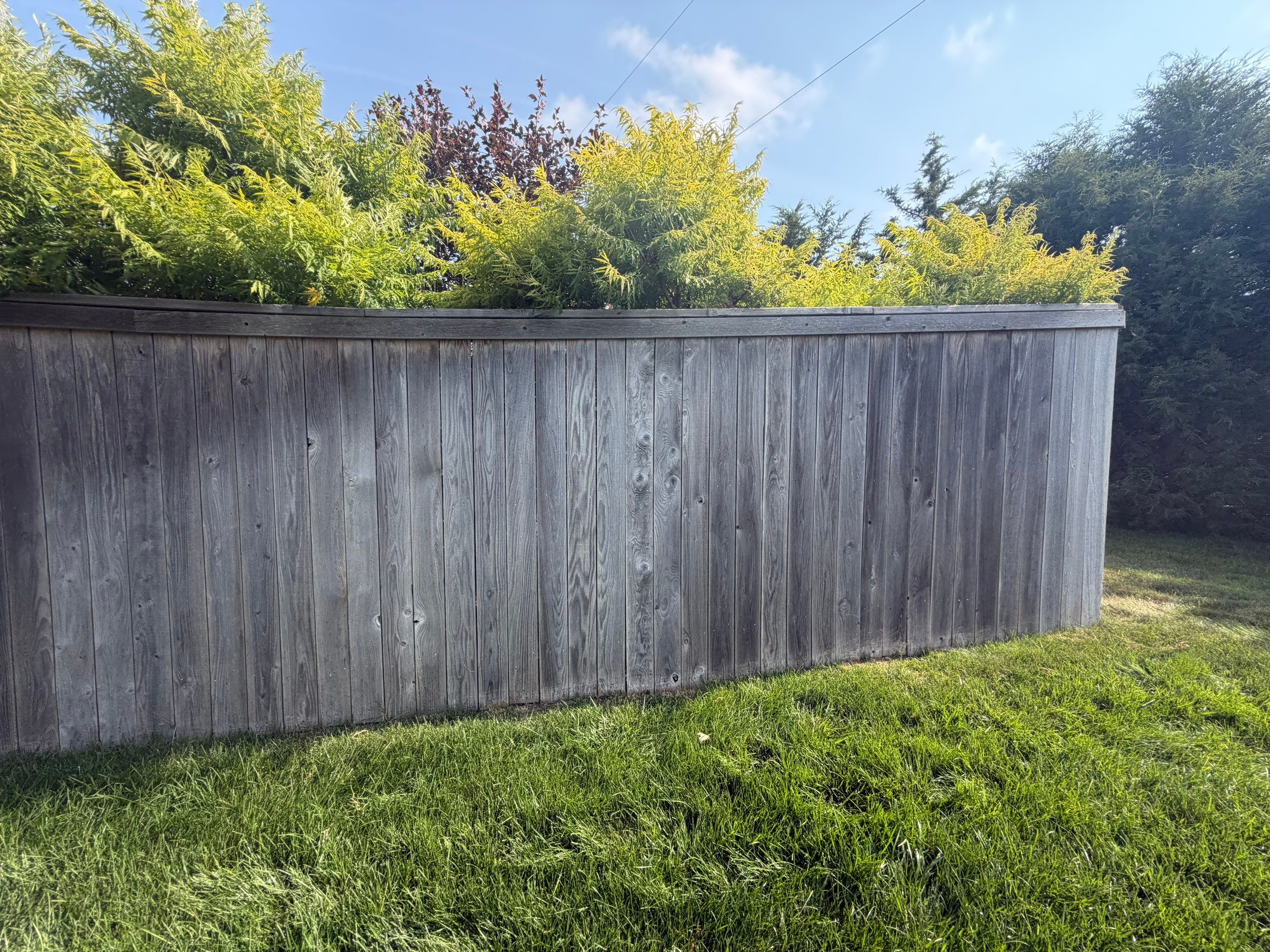 Custom Privacy Fence and Paver Patio Installation in Sioux Falls by Select Painting, Coatings & Garage Cabinets