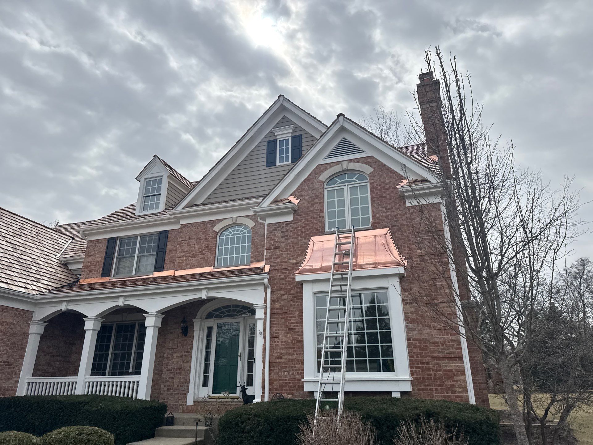 Re-roof: Cedar Shake & Custom Copper by Midwest Building Solutions