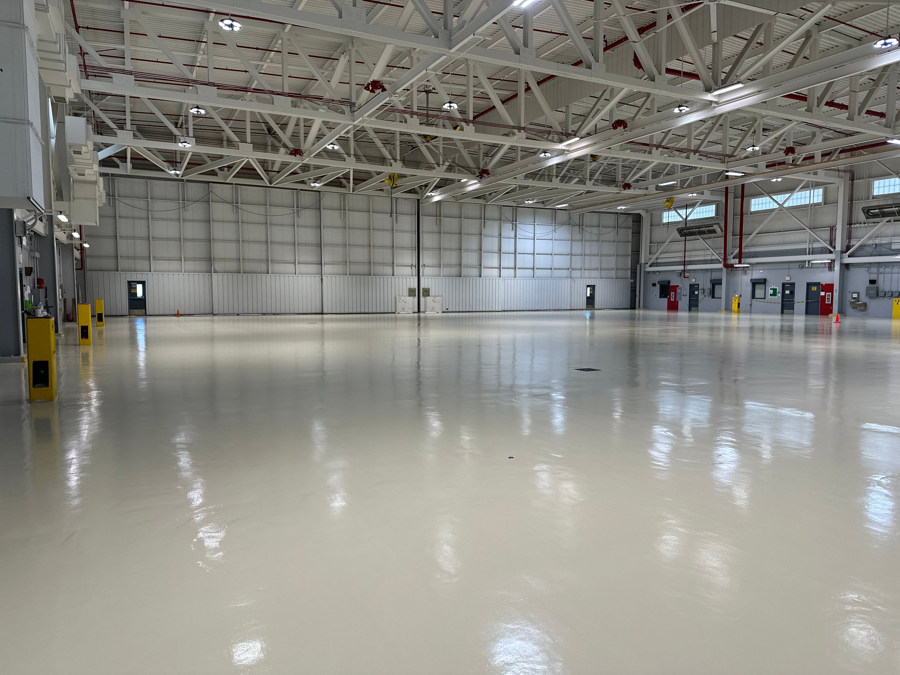 Industrial Epoxy Flooring for Army National Guard Hangar in Mobile by Cornerstone Hard Surface Restoration 