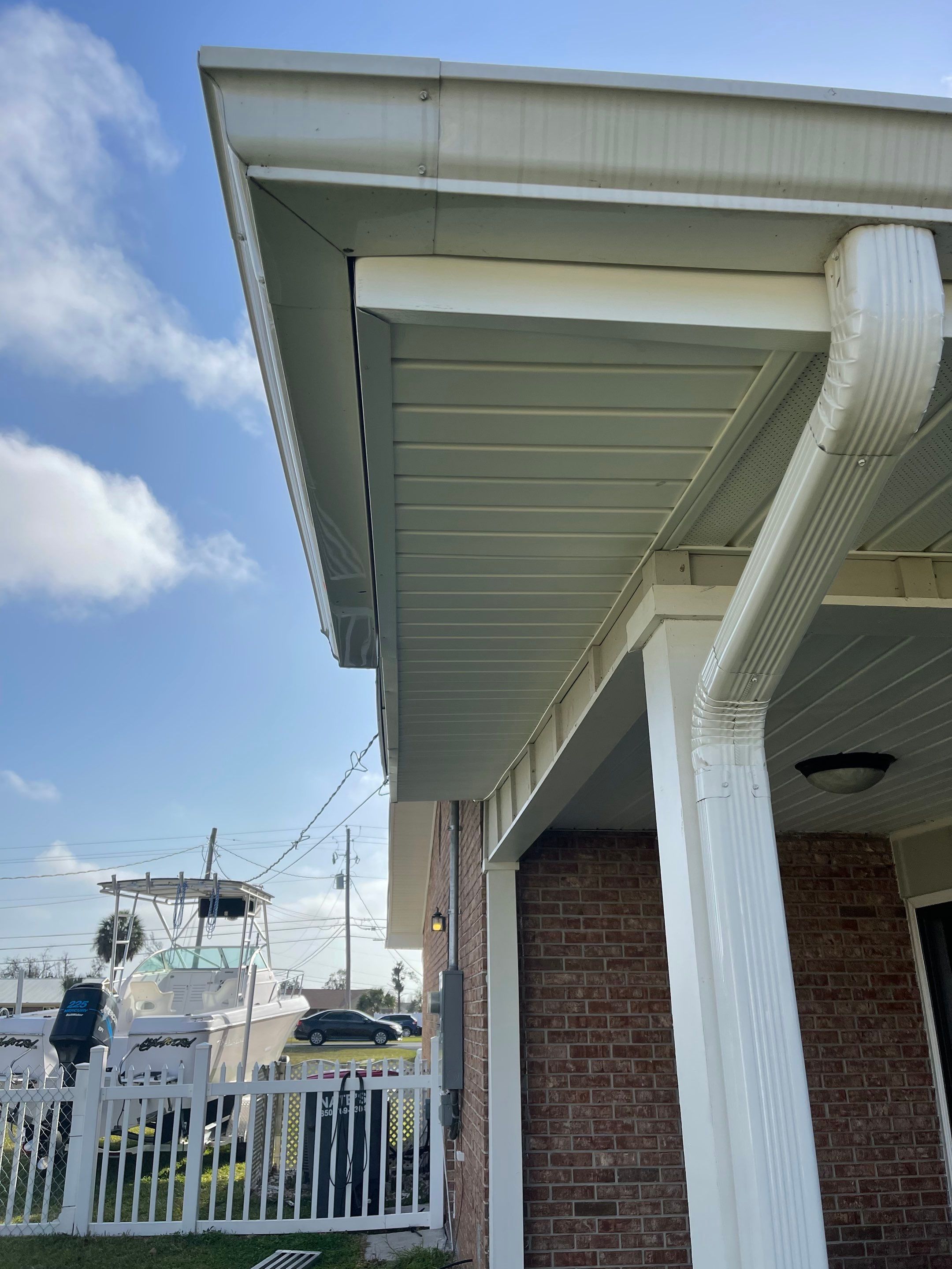 Soffit and Fascia Installation Using White Vinyl Soffit by Gutter Professors