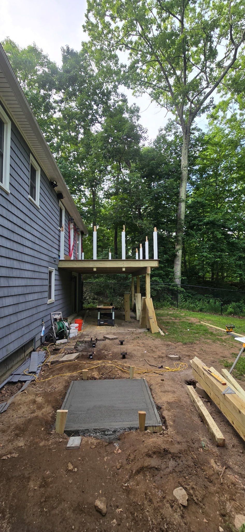 Deck replacement using trex tropical Havana Gold and transcend white railings by DiGiorgi Roofing and Siding Inc