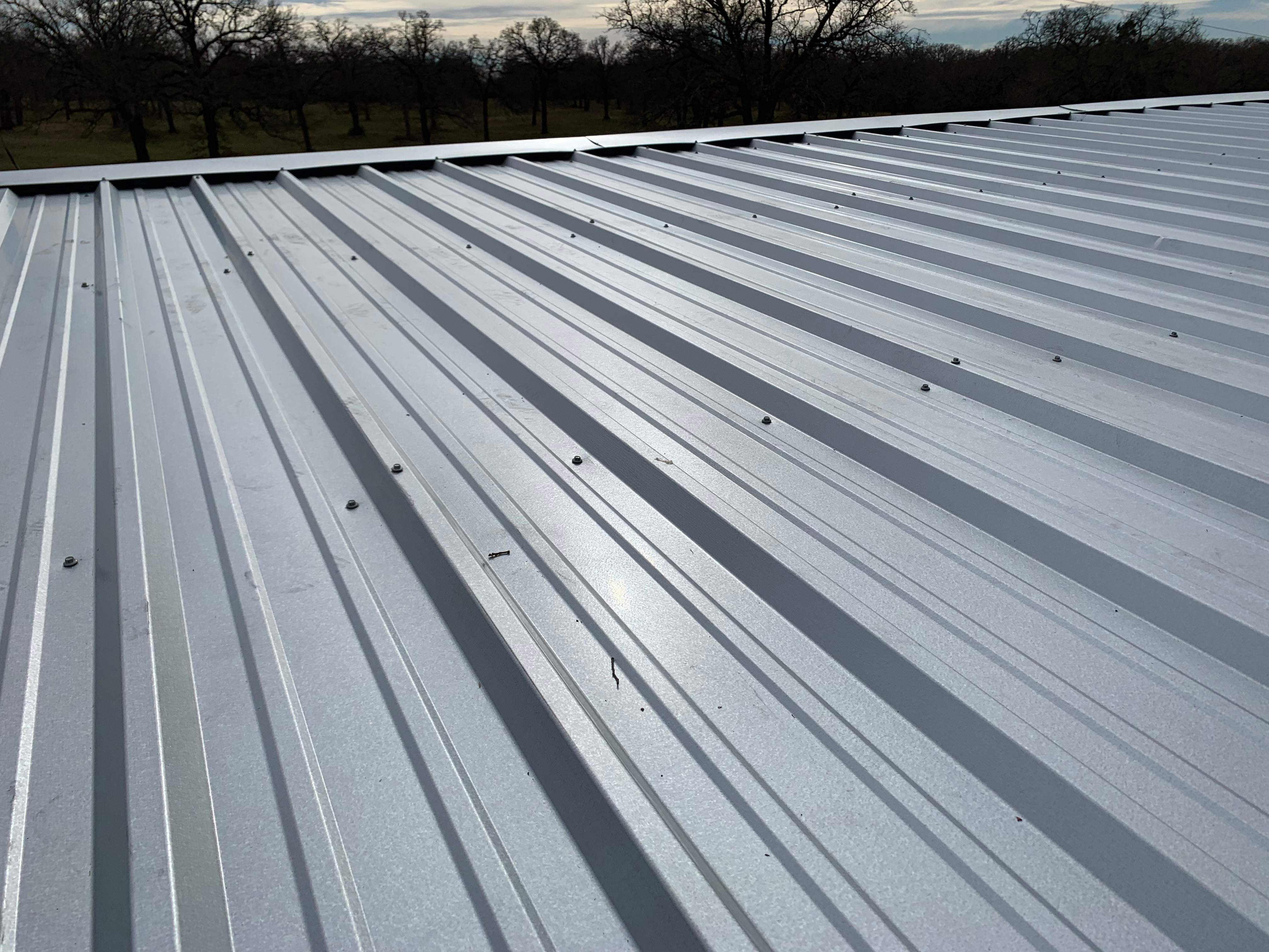 Install new R Panel Metal Roof at a Clients Farm house by First United Roofing & Construction