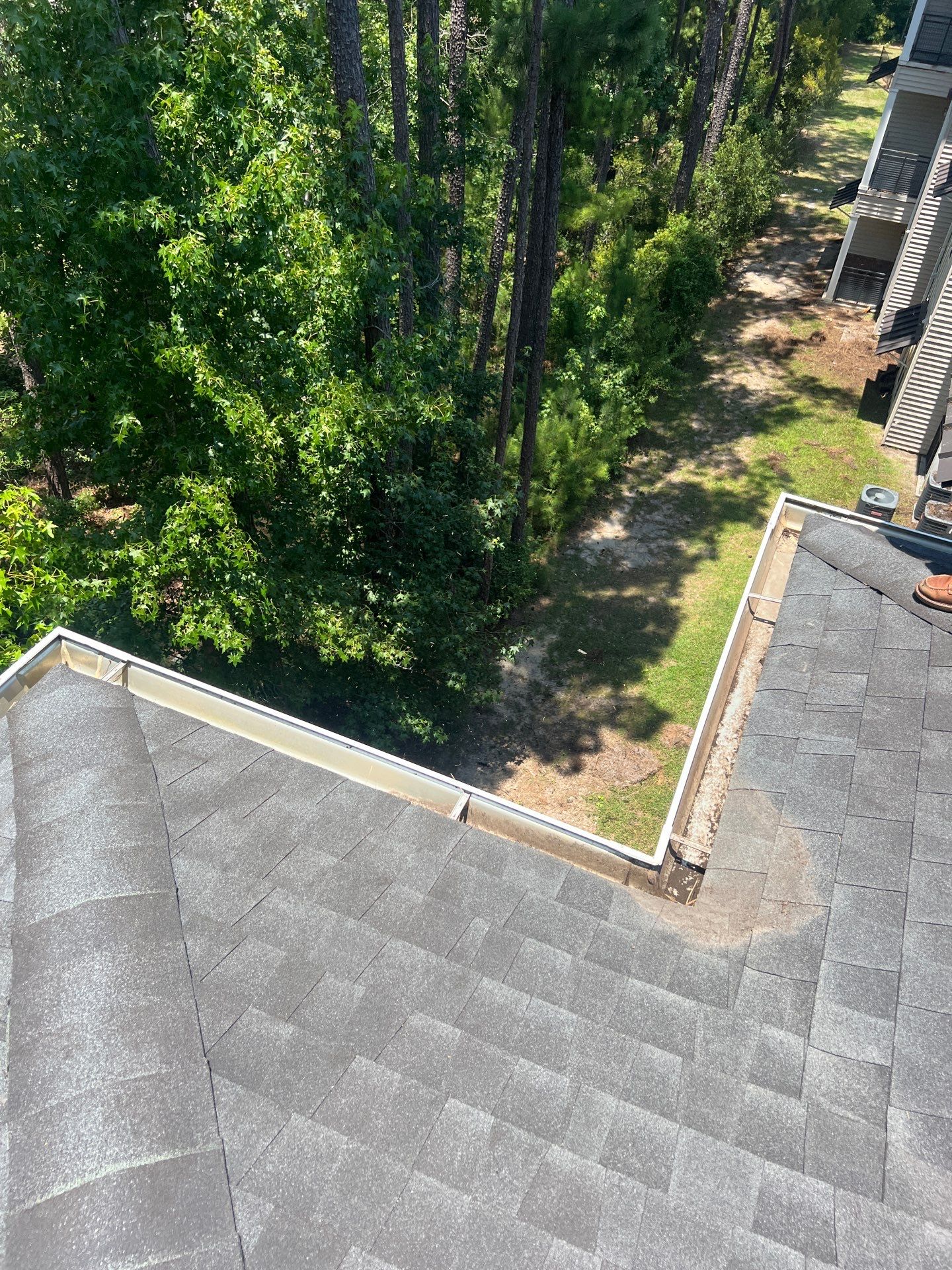 HOA gutter cleaning in Summerville & Goose Creek after  photo showing full gutters.