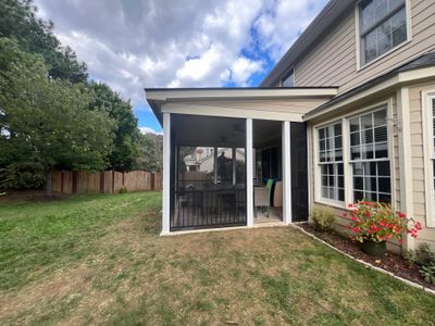 Screened-In Porch Conversion Featuring 6x6 Posts and Black Railings