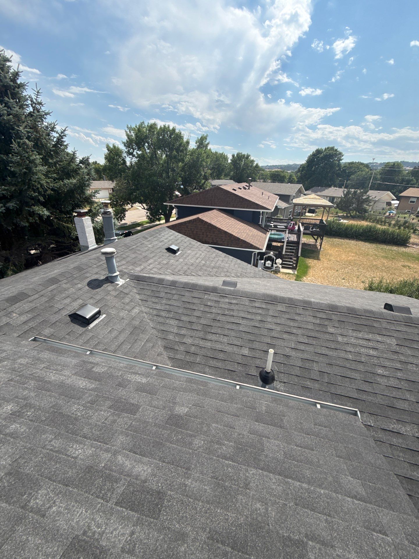 Full Architectural Shingle Roof Replacement and Gutter Installation in Rapid City by Weather-Tite Exteriors LLC