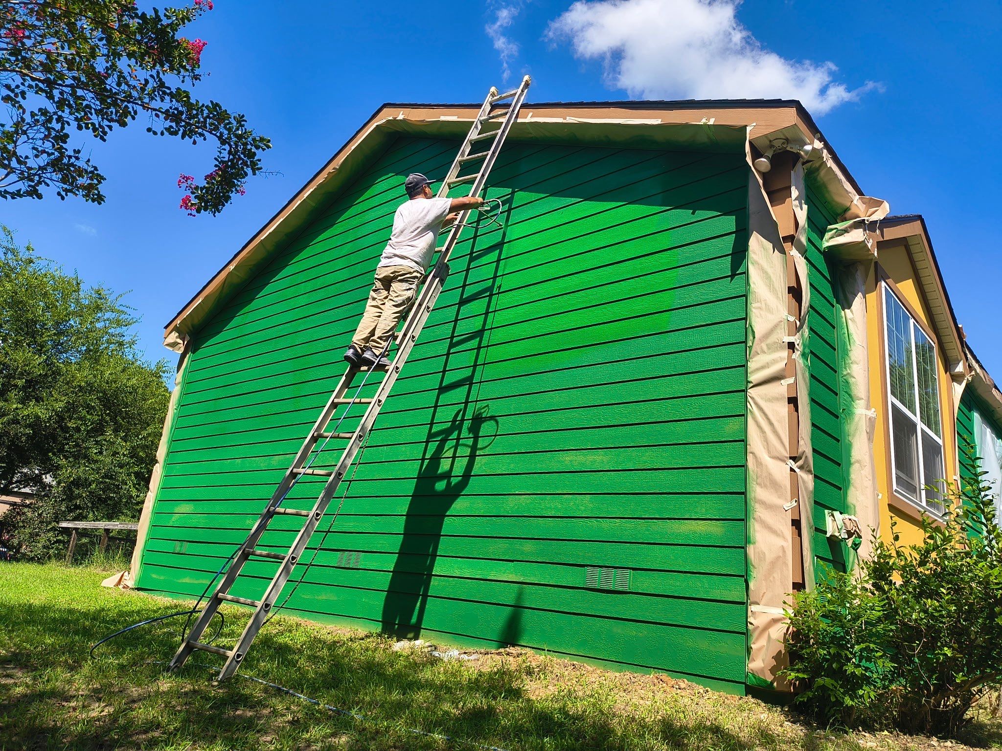 Exterior Painting in Lindale, TX | Bright Green Wood House Repaint by Quality Coats Painting