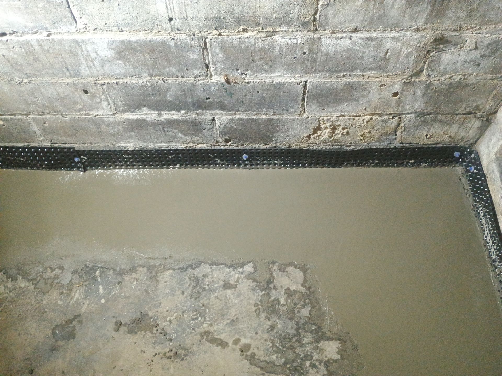 Interior Drain Tile for a South Minneapolis Basement by Waterproofing Northeast