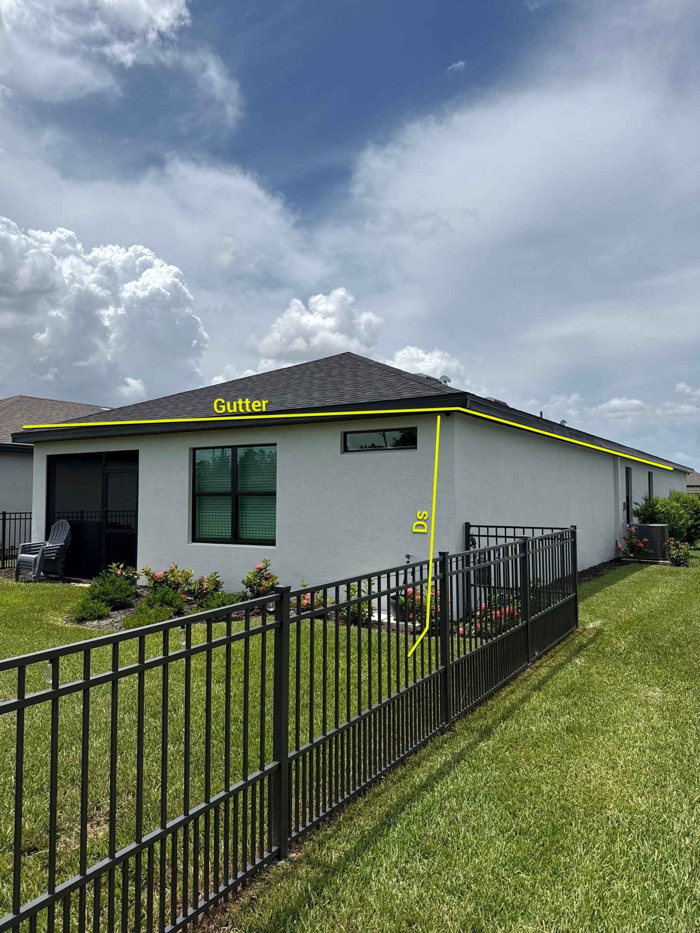 Dark Bronze Gutters and White Downspouts in Sarasota FL by Gutter Professors