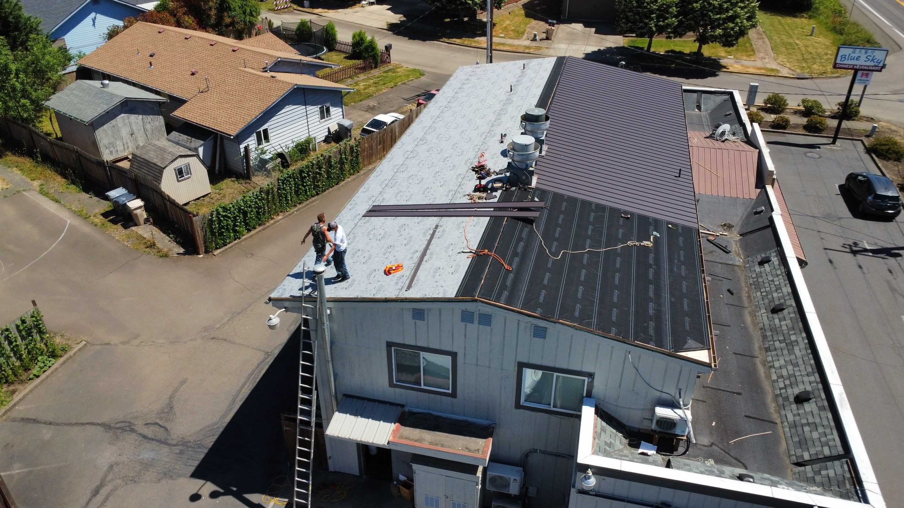 Commercial Flat Roof Installation using Bruce and Dana Snap Lock Metal (Color: Brown) by Orezona Building & Roofing Company, Inc.