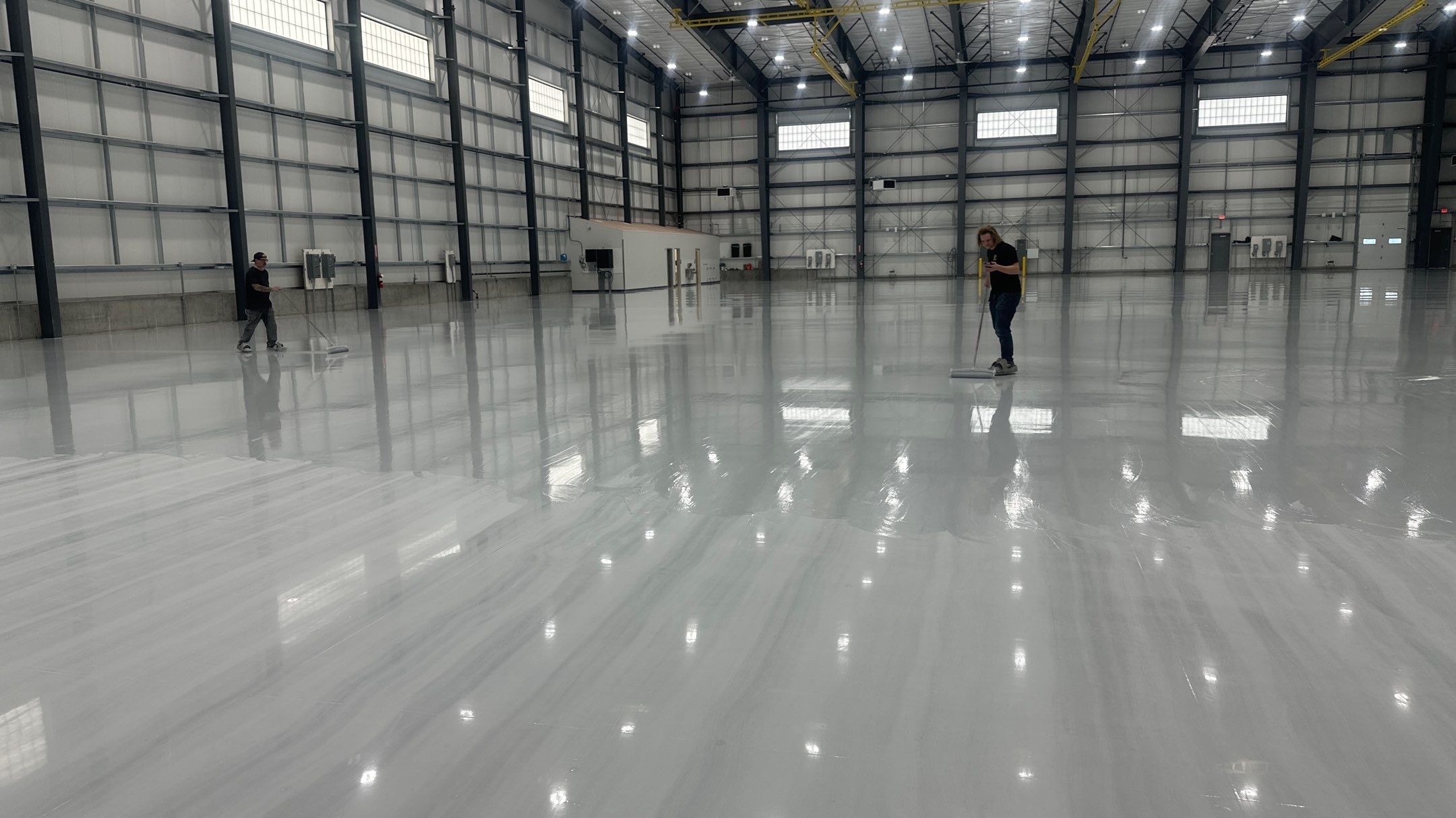 Airplane Hanger using Light Grey Commercial Penntek Epoxy by Croc Coatings, LLC