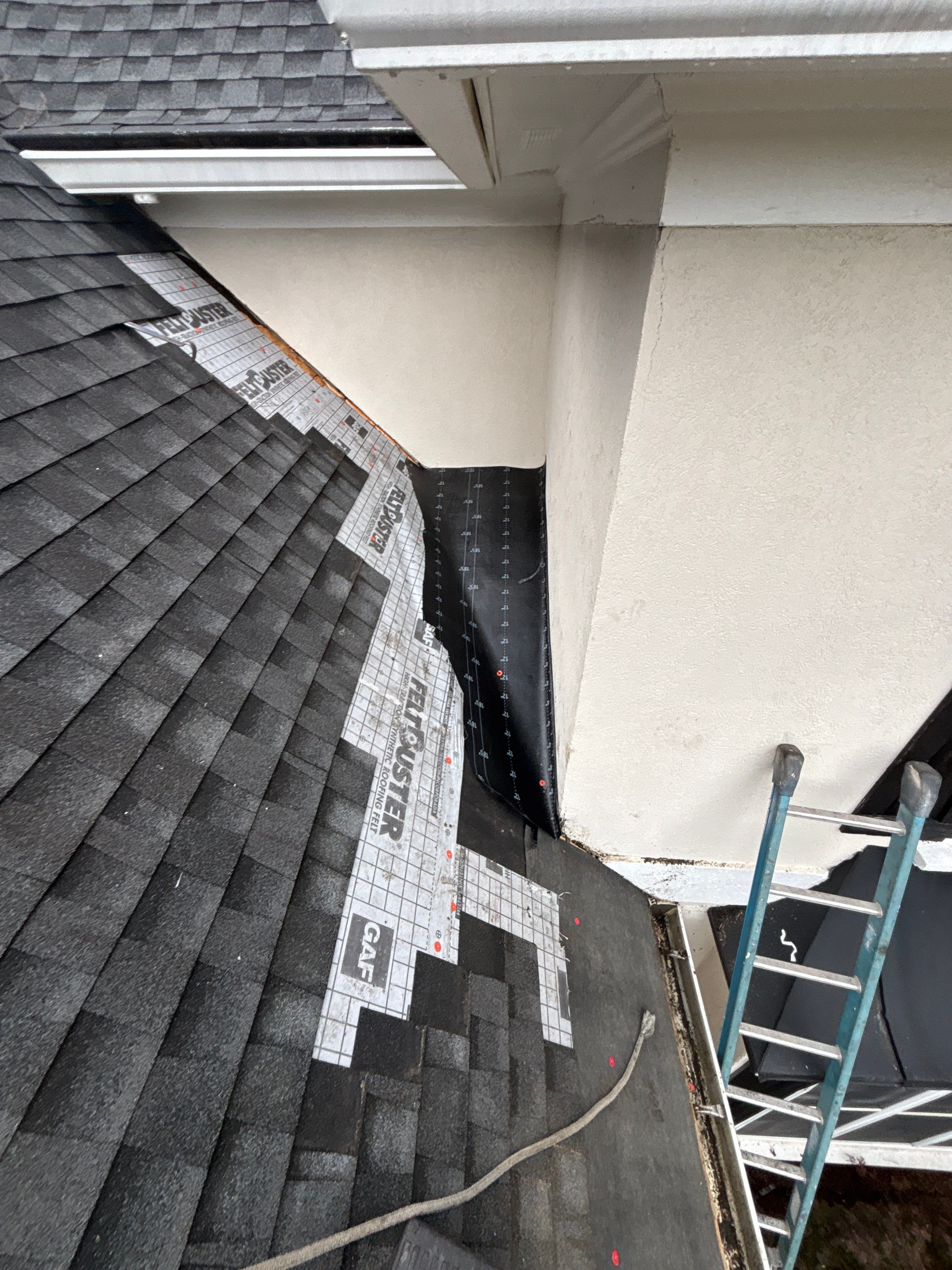Wrong V valley section installed  by Deerfield Roofing LLC