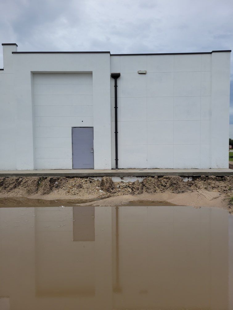 Downspout Installation using collector head in Cape Coral FL by Gutter Professors