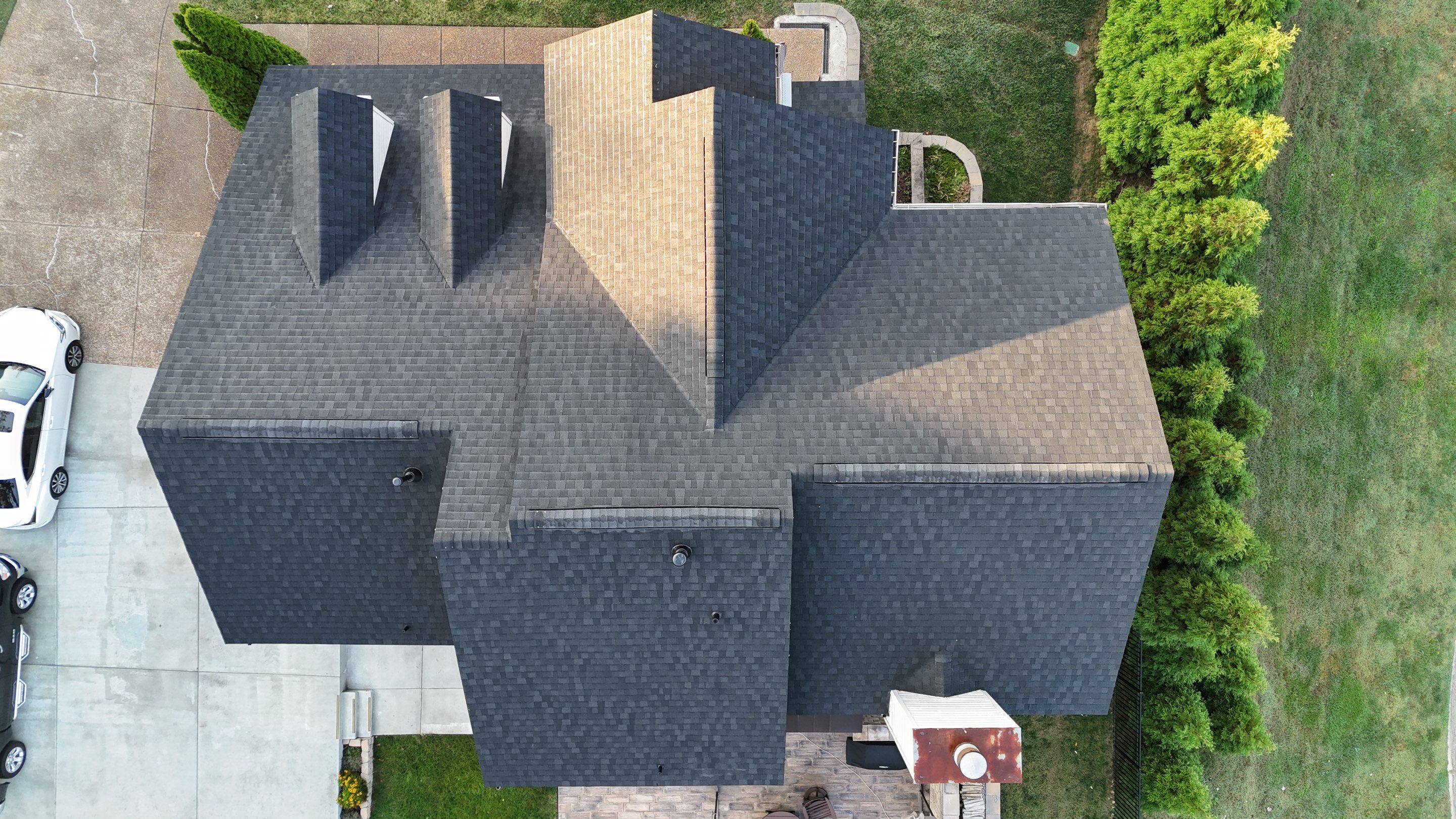 Charcoal Black Re-Roof & Gutters by Royal House LLC