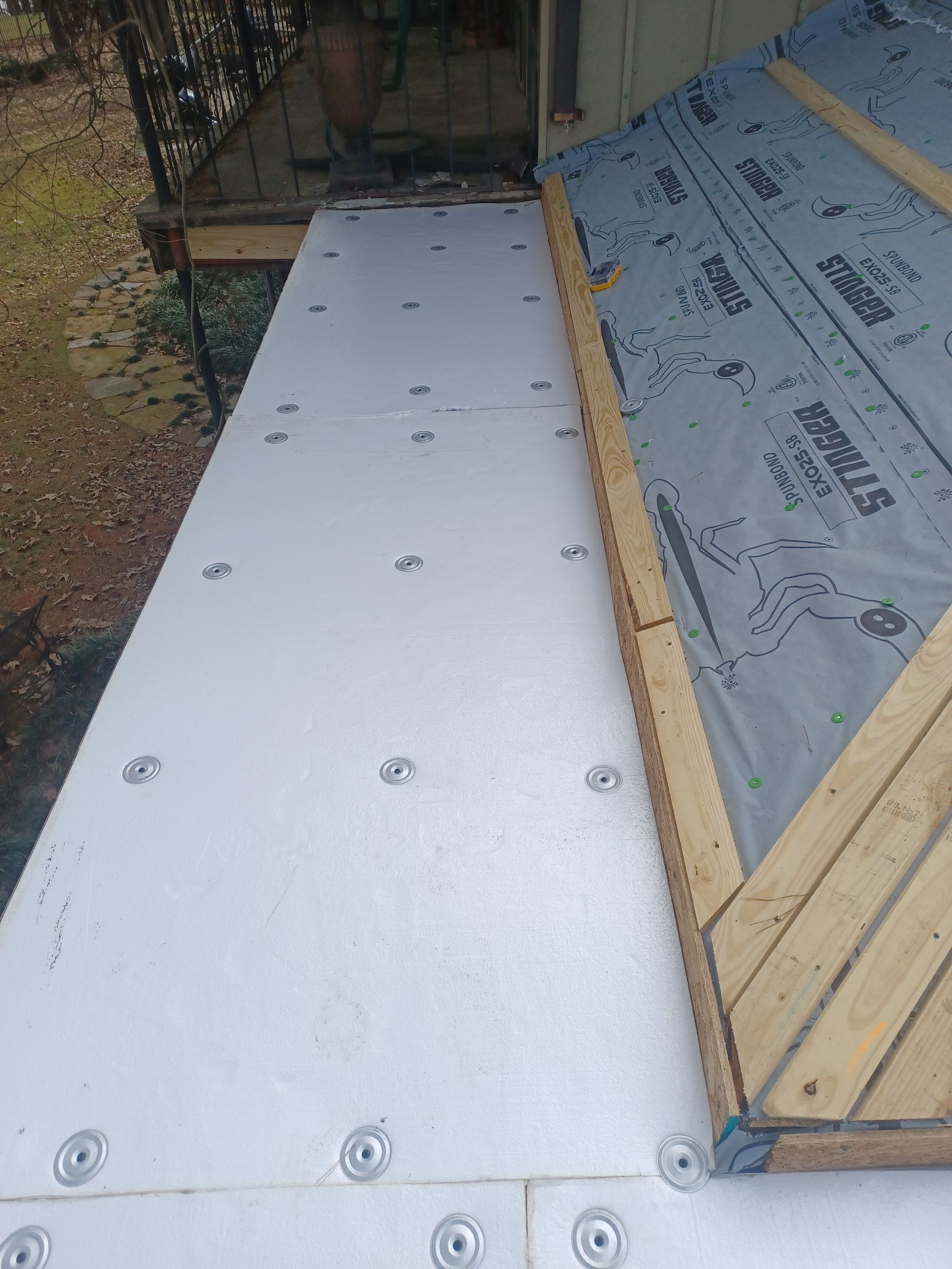 Residential Roofing Installation using PVC membrane and 24 gauge Standing Seam Metal by Hostetler Roofing
