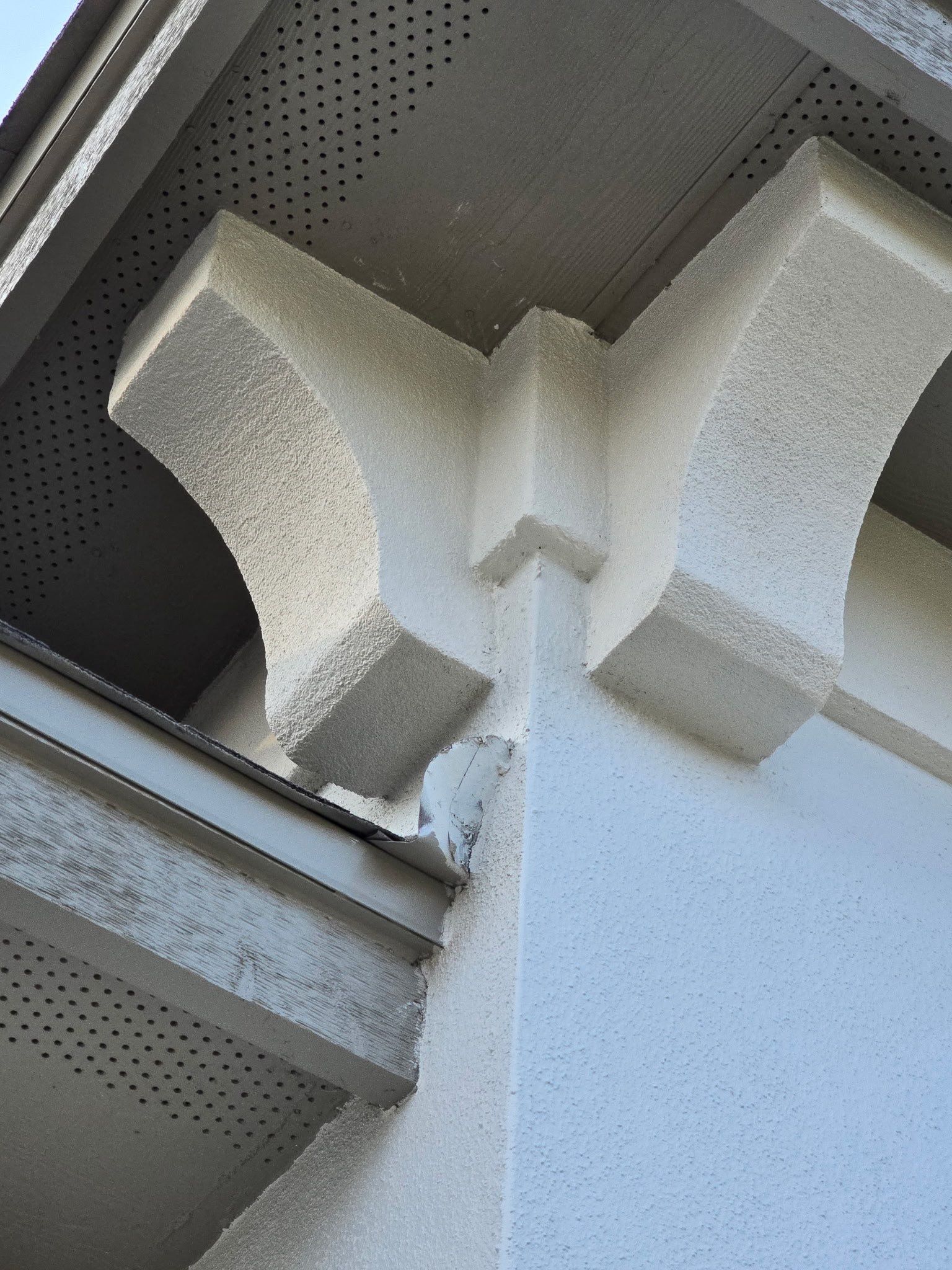 Conroe Elegance: Stucco, Foam Corbels, and Natural Stone Accents. by Apex Conventional Stucco Llc