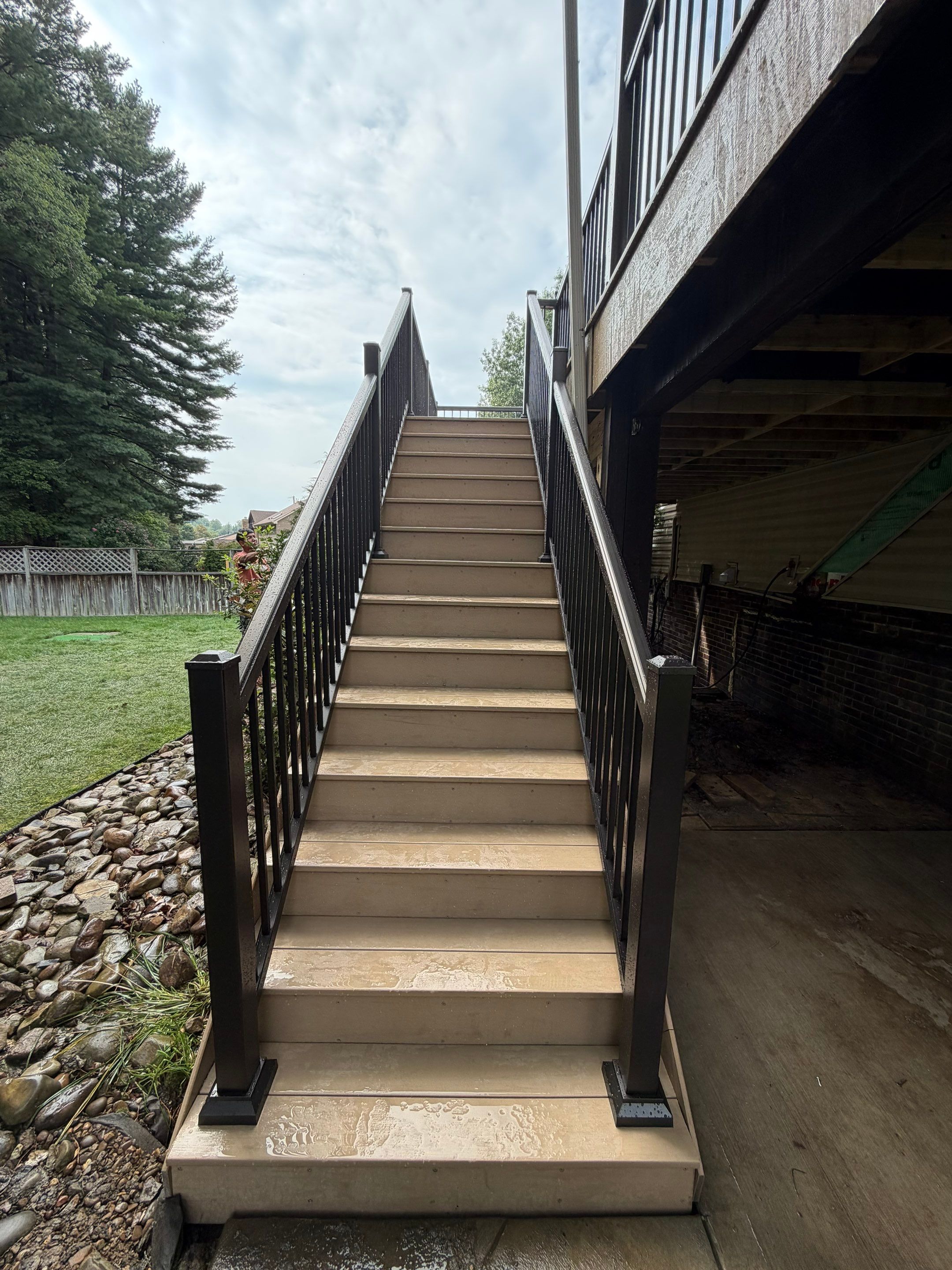 Elevated Composite Deck Installation with Covered Porch in South Park Township by Cousins Roofing Siding & Decks