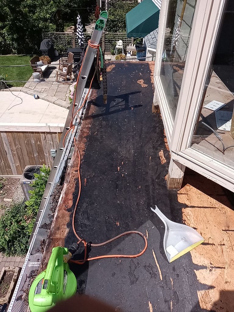 Residential Roofing Installation, Dec-tek walk-out porch roof, siding on garage by Absolute Roofing and Construction