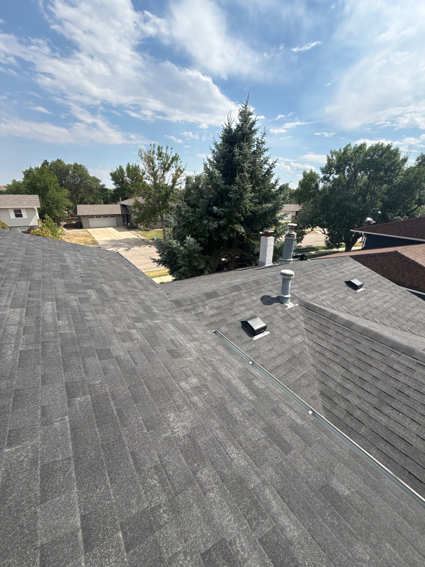 Full Architectural Shingle Roof Replacement and Gutter Installation in Rapid City by Weather-Tite Exteriors LLC