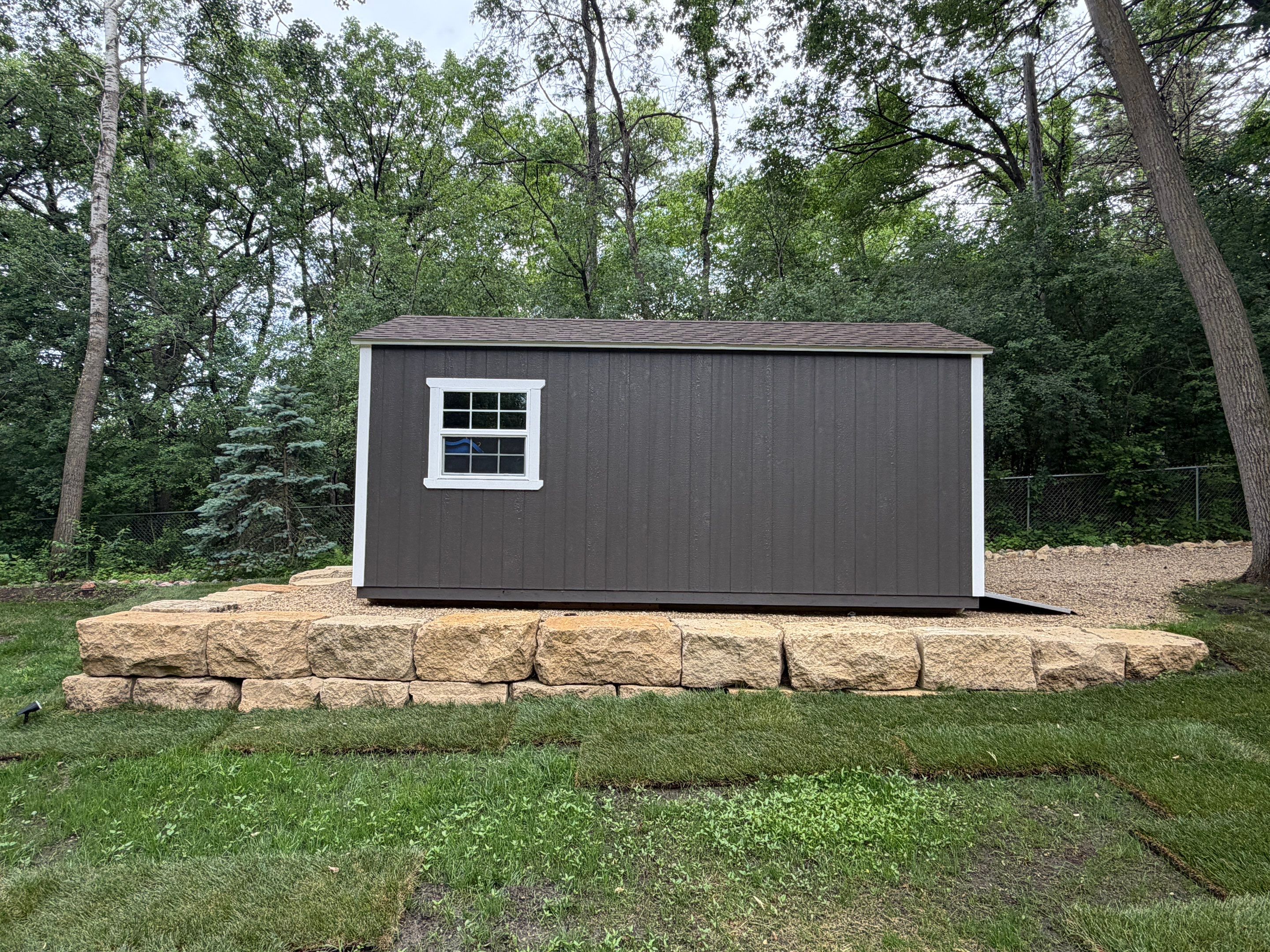 Limestone Boulder Wall  by Sota landscaping