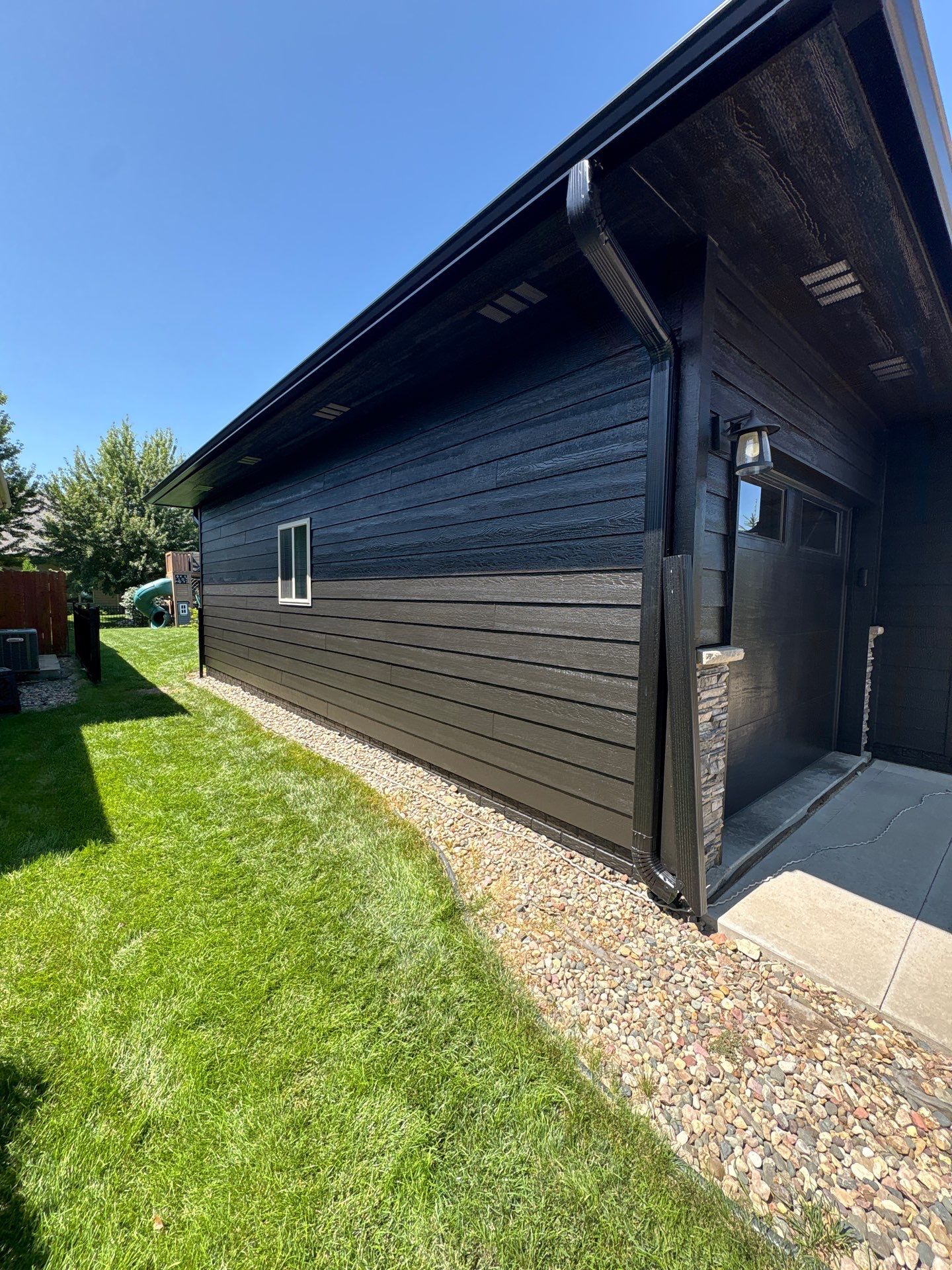 Full Exterior Siding Repaint for Sioux Falls Home and Garage by Select Painting, Coatings & Garage Cabinets