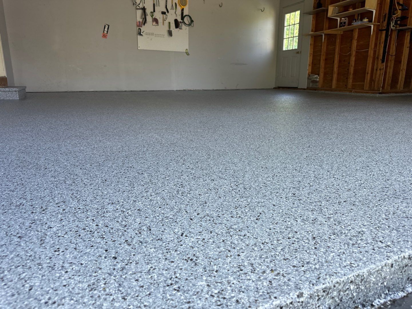 Silverado garage floor coating  by NG Masonry & Construction LLC