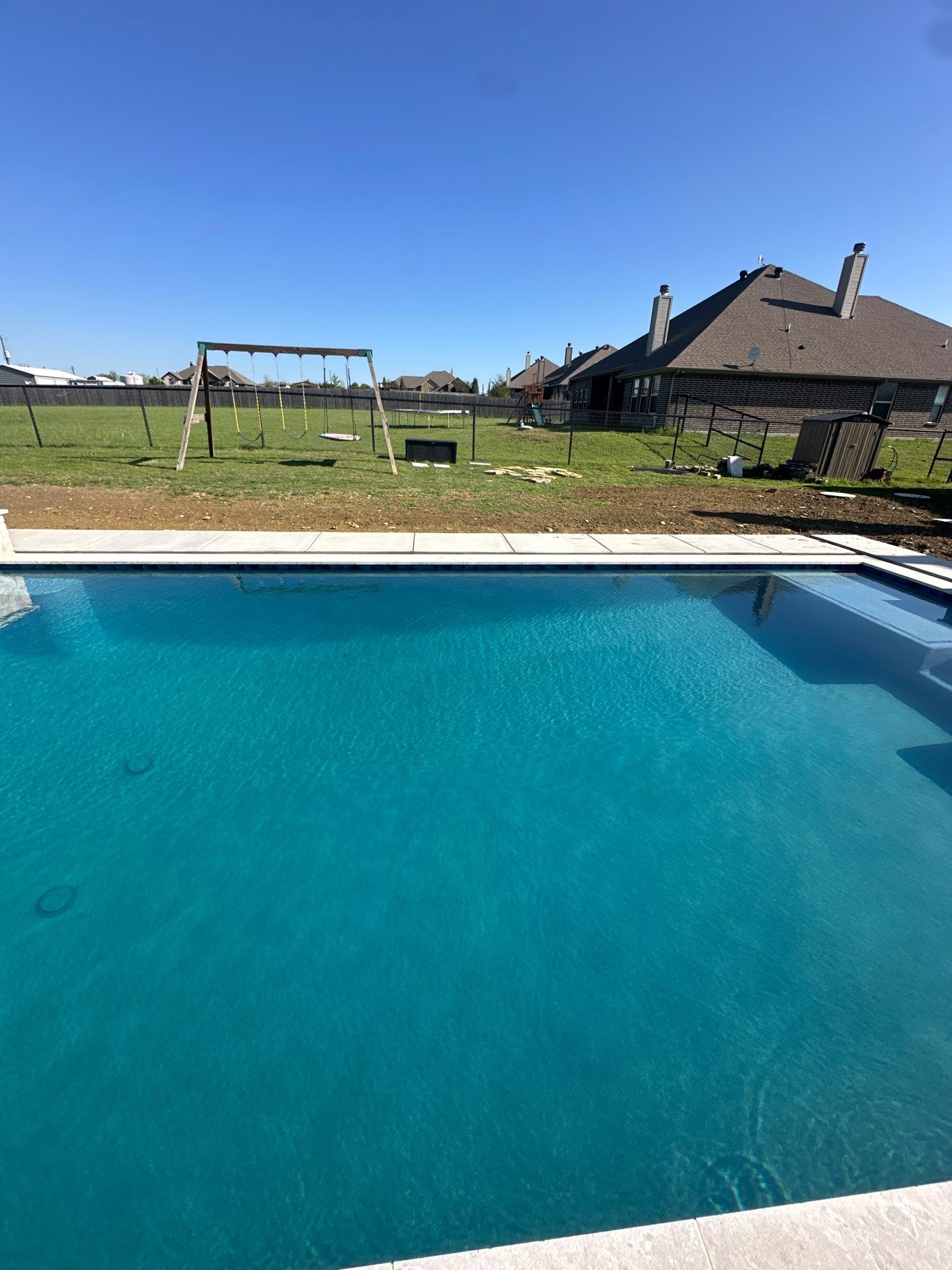 Geometric Pool with Raised Spa and Tanning Ledge by Pinnacle Pools and Spas - DFW