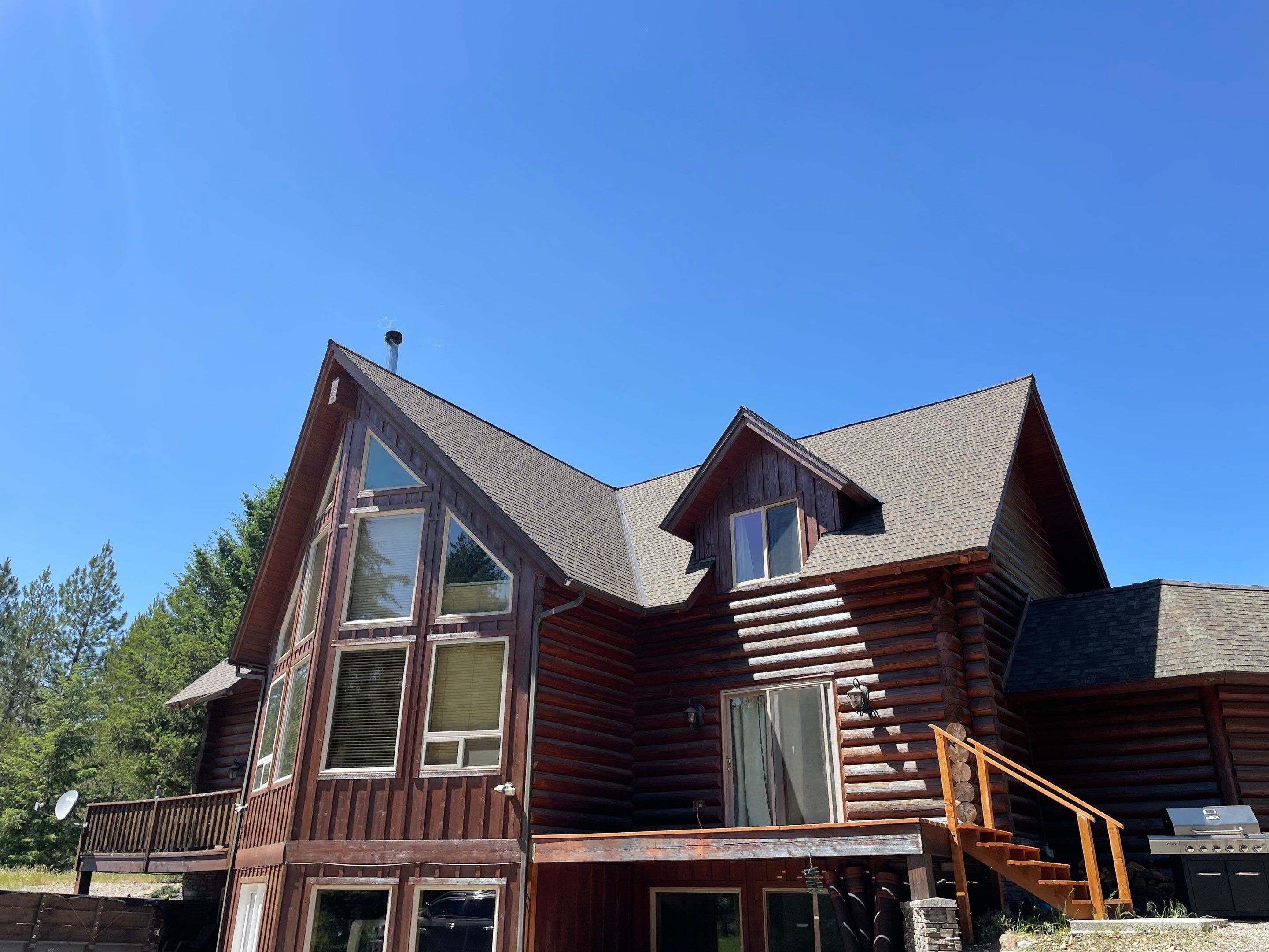 Architectural Shingle Roof Installation for Spirit Lake Log Home Coeur D'Alene Drive Spirit Lake, Idaho, 83869 (SECTION A) PARTIAL ROOF REPLACEMENT - CertainTeed 50 Year Material Guarantee - CertainTeed Workmanship Guarantee: 30 Years - CertainTeed Warranty Transfer Period: 20 Years - Certainteed Landmark® Shingle - Heather Blend by Alpine Roofing